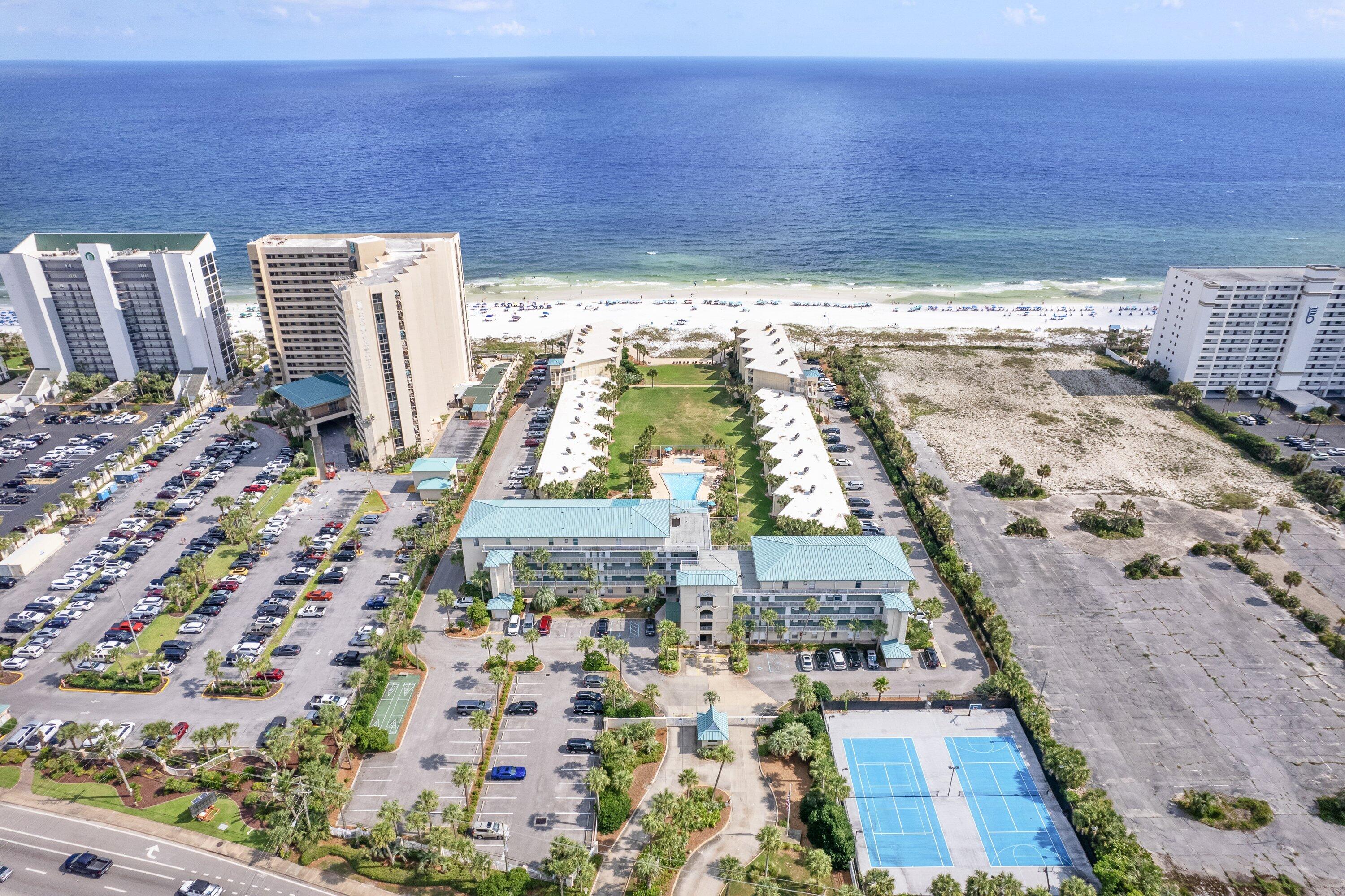 RARE & UNIQUE ... with unobstructed GULF VIEWS from 2 balconies in this tastefully furnished gulf front unit. A spacious 1500 square feet floor plan with a first-floor layout that seamlessly integrates the kitchen, living and dining spaces embodying a harmonious blend of functionality & sophistication ideal for cherished moments. With 2 bedrooms and 2.5 bathrooms, this gulf-front unit accommodates up to 8 guests, making it perfect for romantic getaways, family vacations, or group retreats.Silver Dunes includes an array of resort-style amenities, including an inviting swimming pool, pickle ball, tennis courts, and barbecue areas, not to mention private & deeded beach frontage. Located in the heart of Destin near all the action.