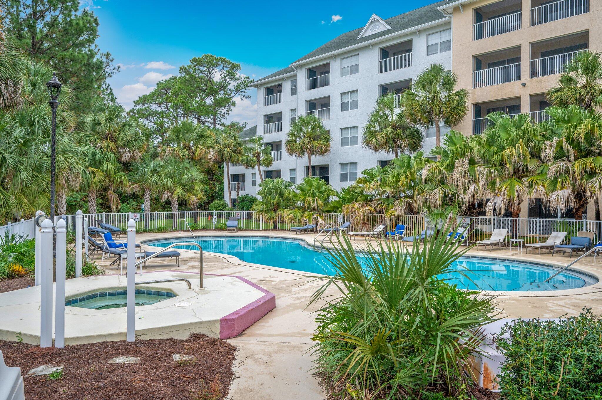 Welcome to this inviting top-floor, end unit condo at the well-maintained Florida Club at Bluewater Bay. This distinctive residence stands out with its soaring vaulted ceilings, while its end-unit position offers the advantage of an additional dining room window with an abundance of natural light not found in interior units. Step into comfortable living with practical wood-look tile flooring flowing seamlessly throughout the home. The updated kitchen features granite countertops and a stylish undermount stainless steel sink, perfect for both everyday living and entertaining. The bathroom continues the modern feel with matching granite finishes. Escape to your private screened balcony,  where peaceful views of the sparkling pool and tranquil wooded pine landscape create the perfect setting for morning coffee or evening relaxation. An exterior storage room provides added convenience for your storage needs. The Florida Club's appealing amenities enhance your lifestyle with access to a refreshing pool, relaxing hot tub, well-equipped fitness center, and social spaces featuring grills and picnic areas. Elevator access ensures effortless living at every level. Perfectly positioned for both work and play, enjoy quick commutes to Eglin Air Force Base and weekend getaways to the stunning Emerald Coast beaches. This well-situated end unit offers the ideal blend of comfort, convenience, and Florida living at its finest.



