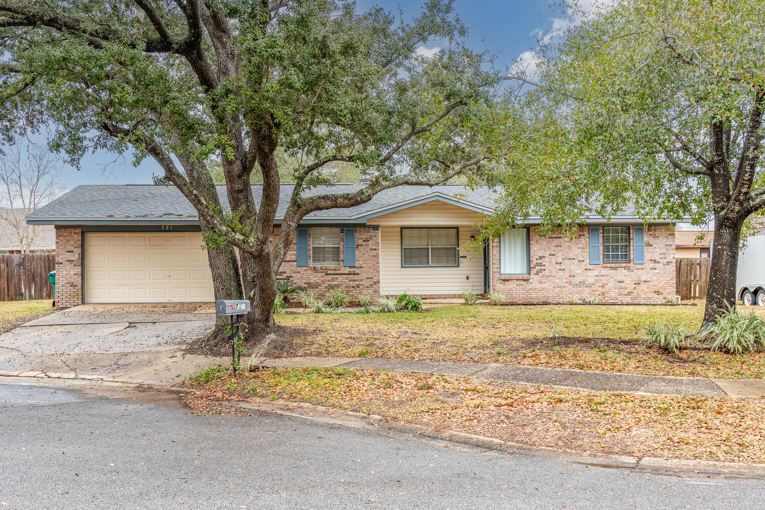 This wonderful home at 721 Osage Drive is ideally situated in a quiet cul-de-sac, providing a peaceful retreat just minutes from all the conveniences of Fort Walton Beach. With easy access to Hurlburt Field, Eglin Air Force Base, as well as shopping and dining, this location offers the perfect balance of tranquility and convenience.Step inside and experience a spacious living area with brand new laminate flooring, soft designer colors, and crisp white trim. The corner fireplace with a mantle adds warmth and charm, providing both ambiance and heat for the living room and dining room--perfect for entertaining guests or cozy family gatherings.The kitchen is a cook's dream, featuring abundant counter space, ample cabinetry, and durable flooring throughout. The master bedroom offers a peaceful sanctuary with a private bath, extended vanity, and a walk-in closet. Two additional bedrooms and a full bath are thoughtfully separated from the master, ensuring privacy for all family members or guests.

Outside, relax and unwind on the screened-in patio, overlooking the large, fully fenced backyard. The space is perfect for outdoor living and entertaining, complete with a lawn pump and sprinkler system to keep the yard lush and green year-round.

The oversized garage offers plenty of storage with built-in shelving and a washer/dryer hookup, providing even more convenience. For added peace of mind, the home also features hurricane screens, offering protection during stormy weather.

With its ideal location close to shopping, dining, and all essential amenities, this home truly offers the best of both comfort and convenience. Don't miss out on the opportunity to make this gem your own!