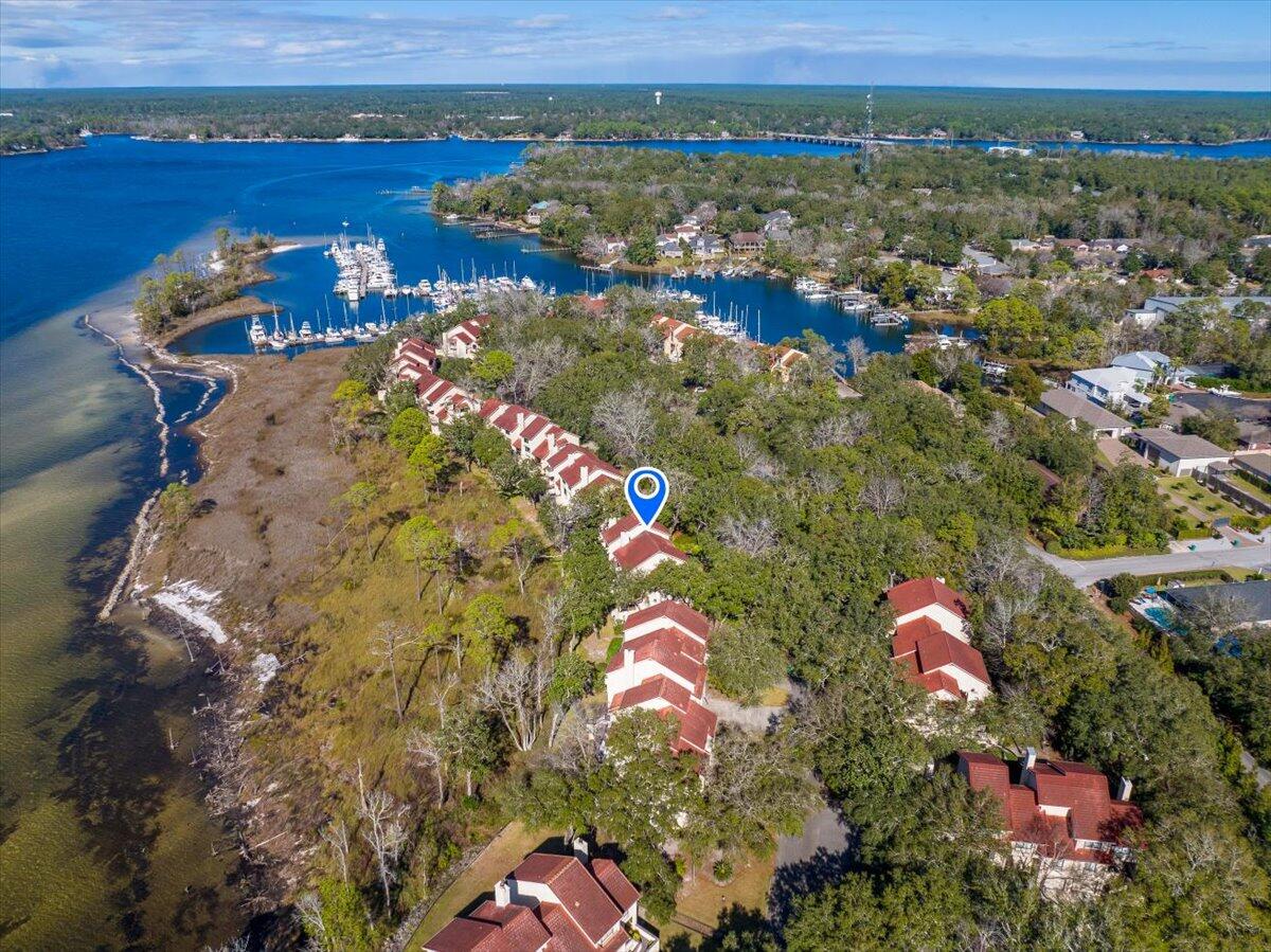 Waterfront townhome with unobstructed views of Choctawhatchee Bay. Enjoy the evenings on the two balconies or take a short walk to the marina and restaurants. Minutes from the beach and military bases. Two separate living areas and a loft/office space. Both bedrooms enjoy en suite bathrooms. Sold with finishings, including washer/dryer and televisions. This home is ready for you or for a furnished rental. Act quickly to get your perfect view of the bay and osprey nest!