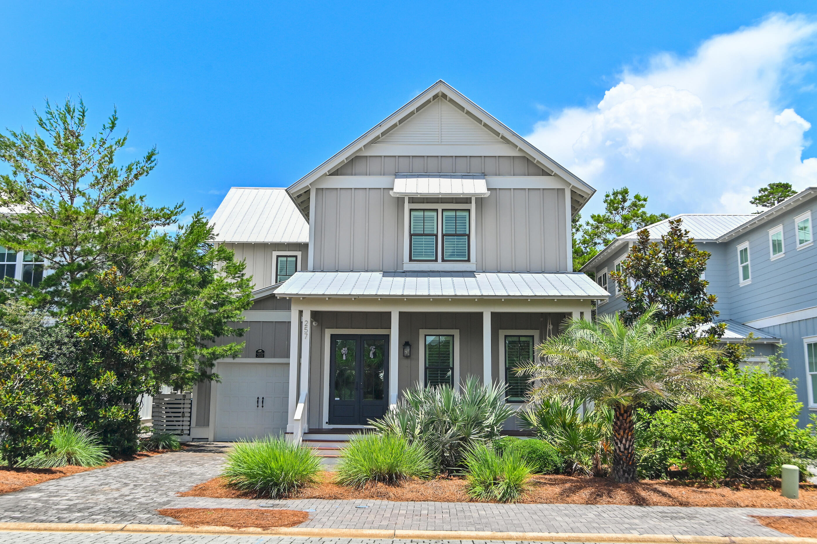 Must-see beautifully designed coastal home in immaculate condition in the gated and peaceful community of Lakeside at Blue Mountain Beach! This exquisite home is a non-rental and it shows as it is in like-new condition. It is fully-furnished and ready to move in. All of the interior walls and exterior trim have just been repainted and the wood floors have just been refinished. The home has custom shutters throughout with large closets and shiplap in the master and the downstairs bathroom. The entire house is very bright and airy with large windows featuring 4 ensuite bedrooms plus a double bunk room and an upstairs screened in porch with a swing, all providing ample space for relaxation and entertaining. There is a very private backyard that backs up to Grayton State Park with a covered porch, fire pit, and outdoor barbecue. You and your guests can enjoy the neighborhood amenities that include a pool, a playground, Grayton State Park, and the white sandy beaches which are just 1/2 a mile away. There are many popular restaurants and hangouts just a short walk away such as Blue Mt. Creamery, Blue Mountain Bakery, Red Fish Taco and Justin Gaffery's Art Gallery. Don't miss this opportunity with this slice of paradise!