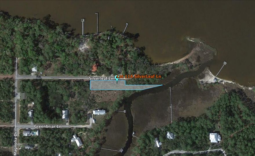 Large lot on McQuage Bayou at one of the best prices in all of Magnolia Beach Subdivision. Typical lots in Magnolia Beach are 50'x150', but this lot is 50'x300', plus additional waterfront property, estimated to be 30'x130'. Neighboring lots have boat docks, and boat ramp/launch is only a few streets to the south. Docks required to be permitted through Corp of Engineers. Seller asking buyer to pay $1,125 towards cost of survey and elevation certificate needed to complete the sale.Second floor views of McQuage Bayou have great potential.