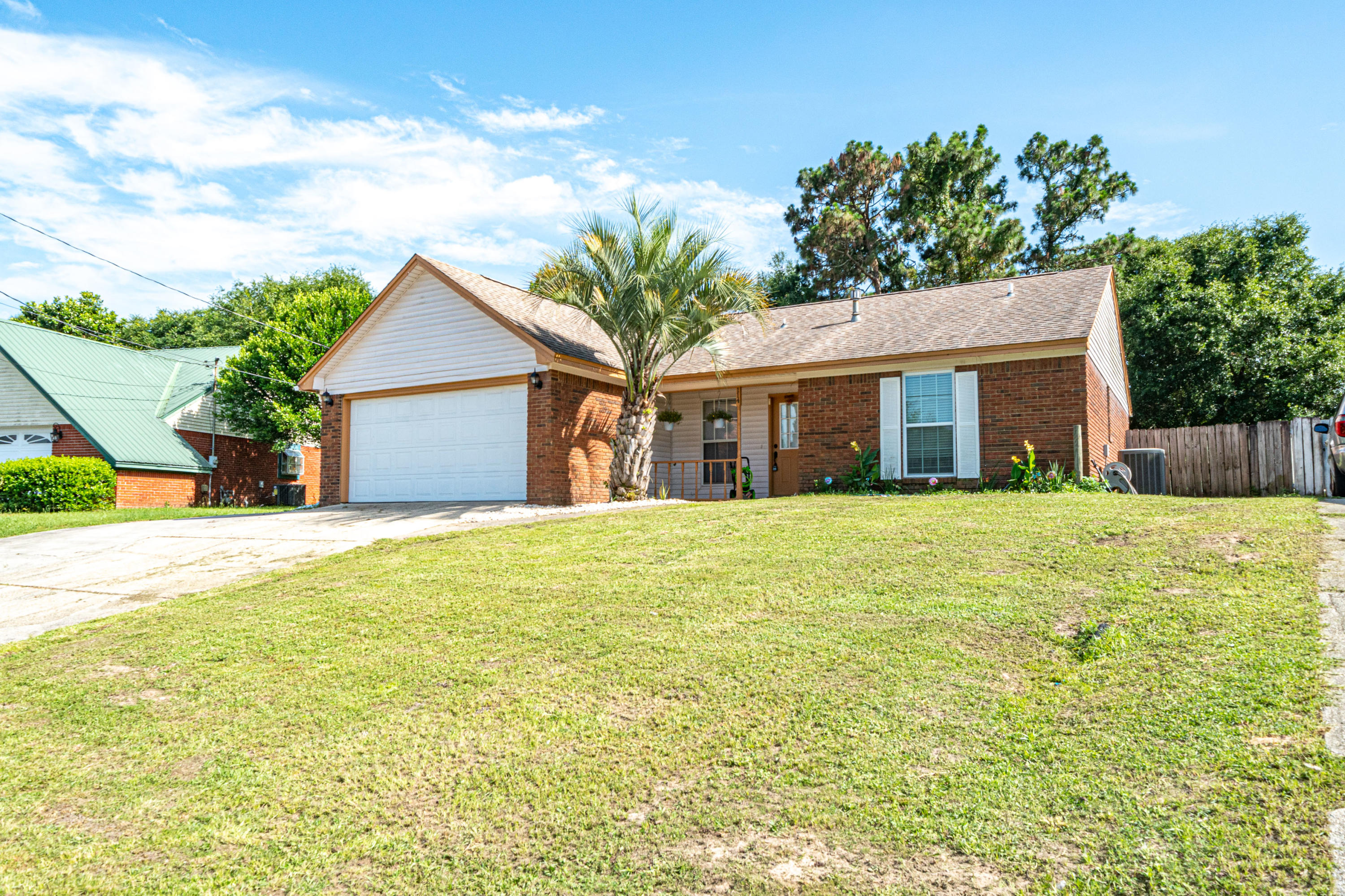 This home comes with a home warranty!!!$1,000 credit for paint with full price offer.Want to live south of I-10?!!!! Only 15 min to Duke field and the 7th Group Compound. 3 bedroom/ 2 bathThis home is move in ready. This home is all brick and has a split floor plan. Roof, water heater, and windows only 4 years old. Large fenced back yard, heated & cooled Florida room, fireplace are some of the features this charming home has to offer. Elementary school bus stop at end of road, middle and high school is in front of neighborhood less than 5 min walk.