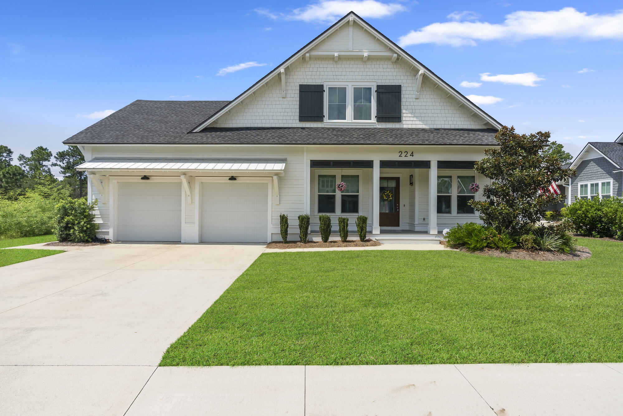 Positioned on the largest homesite within its community, 224 Needle Cast Lane offers 4,066 square feet of carefully considered design, where architectural detail and modern comforts unite. This custom-built residence features five bedrooms, five and a half bathrooms, and a layout that balances open-concept living with spaces crafted for both privacy and connection.The kitchen is a statement in itself, anchored by a dramatic marble waterfall-edge island and complemented by luxury appliances and bespoke cabinetry. Hardwood floors run throughout, adding warmth and refinement, while two thoughtfully placed wet bars--one upstairs, one downstairs--underscore the home's capacity for entertaining. The primary suite presents a custom-designed closet and serene retreat, while the fifth bedroom upstairs offers flexibility as a game room or media room, complete with its own wet bar. Beyond the interiors, a large enclosed back patio with built-in grill flows seamlessly to the heated saltwater pool, enhanced by upgraded pavers and a fenced backyard that extends the sense of retreat.
Additional appointments include a whole-home generator, whole-home surge protector, air conditioned garage, expansive storage, and the distinction of a cul-de-sac setting, further elevating the sense of privacy.
Defined by its scale, detail, and livability, this home embodies a lifestyle of elegance and ease in Inlet Beach.