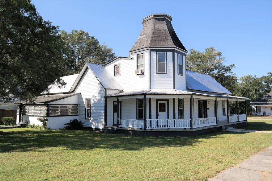 Great opportunity to own a home in the heart of Defuniak Springs Historic District, w/in walking distance to Lake Defuniak public park & boat launch. Numerous activities, events, parades...& the famous Christmas Reflections that light up Circle Dr. every year! You can't help but fall in love w/ this neighborhood! This beautiful Victorian home is full of charm & character you just don't find every day.  Would be a great home for the extended family or even a Bed & Breakfast. Main home is 2858 SF, 3 BR, 3 bth. Den has separate entrance to home & direct access to upstairs BR & bath w/ kitchenette & would make a great guest suite. Garage apartment is 480 SF, 2 BR, 1 bath w/ full kitchen & living. The 2-car garage has attached 4-car carport. RV hook-up in back yard w/ water, sewer & electric.