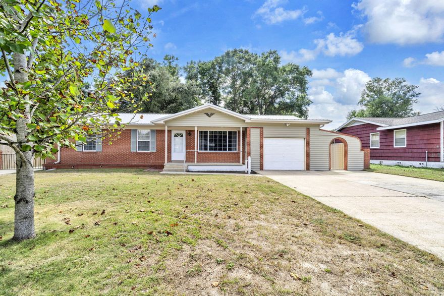CHARMING, 4 BR w/INCOME POTENTIAL, NEW ROOF & LARGE, PRIVATE YARD!  Offering 2 spacious living areas w/gas fireplace, formal dining rm &  large, 4-season porch, this home is designed for both comfort & flexibility. The updated kitchen w/Corian counters, GAS stove, SS appl. & large, custom pantry, adds a modern touch, while REAL wood floors bring warmth & timeless style. The 4TH BR, doubling as a large master suite or private studio apartment, w/a small kitchen area & its own separate entrance is perfect for multi-generational living, guests, or RENTAL POTENTIAL.  A NEW ROOF prior to closing provides peace of mind & affordable insurance. Step outside to enjoy the back patio & large fenced yard, offering privacy & plenty of space for entertaining, pets, or a pool. Your boat or RV can easily be stored alongside your home accessed through a NEW, gated, 2nd driveway.  Other features include an extra large utility room ideal for storage, including a washer & dryer, a gas HWH and an updated electrical panel.   Conveniently located near schools, shopping & both military bases, this Home combines practicality with endless possibilities. Don't miss your chance to make this flexible and well-maintained Home yours.