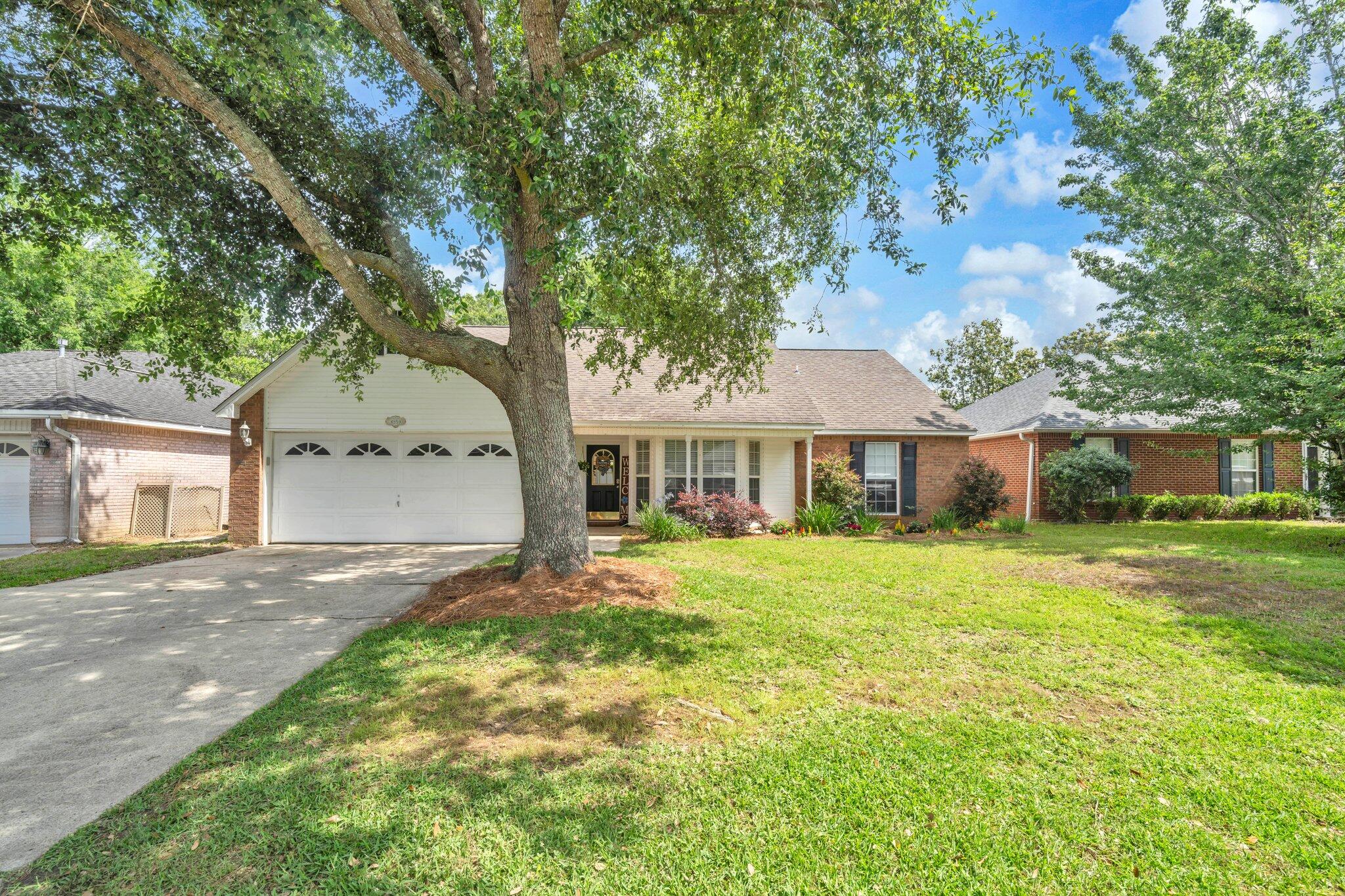 Utopian location! Attractive assumable 4.375% VA loan! Even more, $80,000 in upgrades has refined this hidden gem, a Bluewater Bay classic adjacent to the highly-acclaimed Bluewater Bay Elementary school within the gated community of Parkwood Estates. This 4 bed / 3 FULL bath two-story home has all the comforts your family could desire. Nothing has gone untouched with brand new LVP floors, a redone fireplace and mantle, complete restructure of the kitchen and its cabinets, new paint, new vanities, new toilets...you name it! The first floor has a large family room and formal dining with 2 bedrooms downstairs. The newly carpeted second floor shares a loft with 2 bedrooms either side. The back porch enjoys a fenced backyard with plenty or room for the kids as well as a Tool Shed. Irrigation pump and well replaced 2024. HVAC installed 2022 with 10 year warranty. There's a massive playground across the street to accompany the miles of sidewalk and forested mountain bike trails behind the community. Residents have access to any of the 3 community pools, pickle ball courts, and golf course. A short drive down range road has you accessing the Mid-Bay bridge in minutes exposing your family to the world's finest white sandy beaches of Destin. Come see!