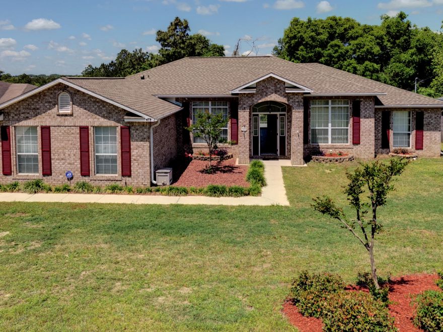 Beautiful brick home in South Crestview features an open/split floorplan and vaulted ceilings. Additionally, the home has crown molding, upgraded bathrooms, porcelain ''wood like'' tile throughout living room and hallways, tiles in kitchen as well and carpet in the bedrooms. New shingled roof (2016) and shower doors in master bathroom, newer (2016) shed in back yard, and OVERSIZED, expanded wood deck that measures 70.5 x 12.5 along the back of the home that oversees the tiered backyard that is sure to please kids and adults! ***Sellers will provide 13-month home warranty with Home Warranty of America with acceptable offer******HOME comes with FREE security system***