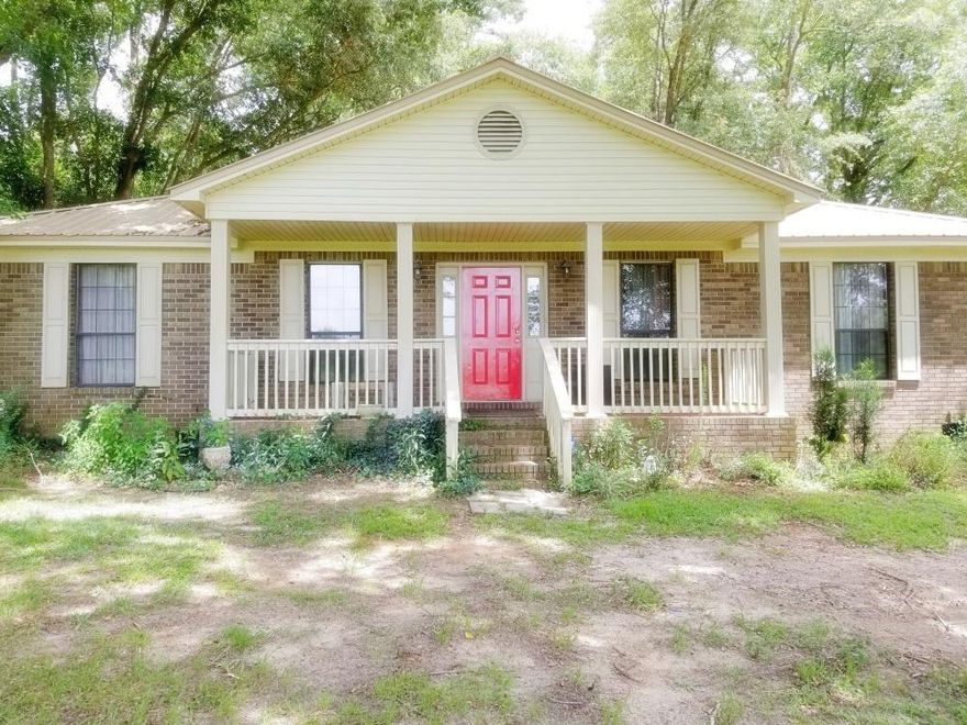 Freshly painted with new flooring throughout. 3 bed, 2 bath brick home with a metal roof on 2 acres. Master bath has a double vanity, separate shower and garden tub, his and hers walk in closets. Two large additional bedrooms, each with it's own walk in closet. Fireplace. Spacious kitchen overlooks backyard raised bed garden area. Three established pecan trees and several fruit trees. 4-stall lean-to barn that has water and electricity with a paddock. Workshop with electricity, pole barn. Well with city water available. Central HVAC was replaced in 2014. Make your appointment Today! More photo's Coming!