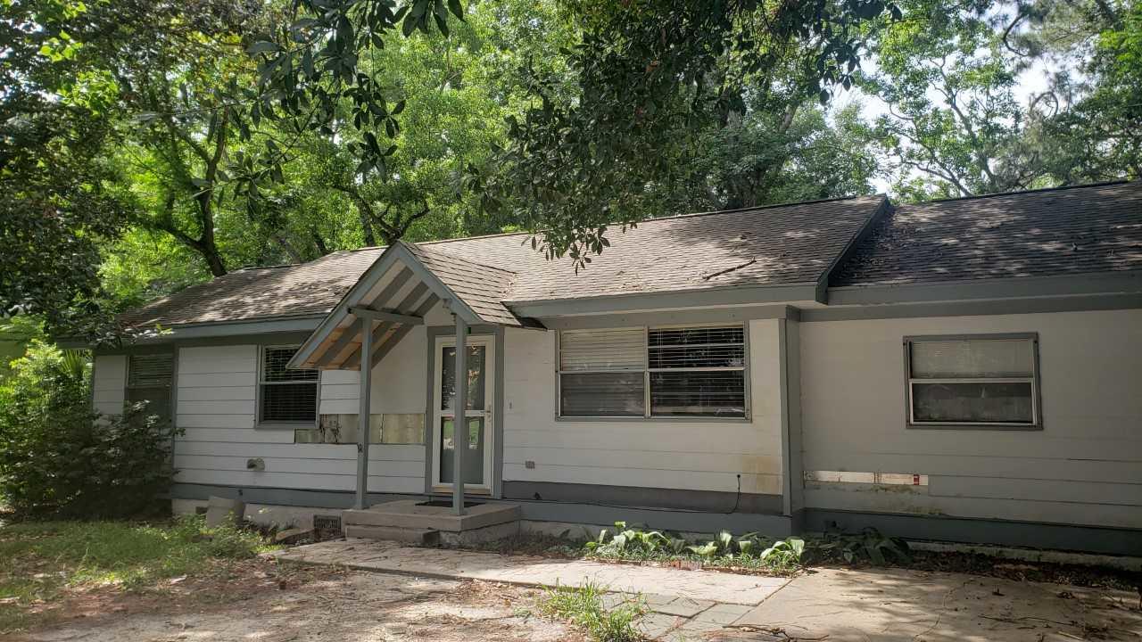 Investor opportunity in a central location! Spacious home located on a large lot in a desirable neighborhood. Priced to sell! Huge bonus room and a large free-standing shop/storage building in the back yard. The home is offered AS IS. Repairs and remodel will be needed. Buyer or buyer's agent to verify dimensions. Buyer to verify extent of repairs needed. Note: In it's current condition this house will most likely not qualify for VA or FHA financing.
