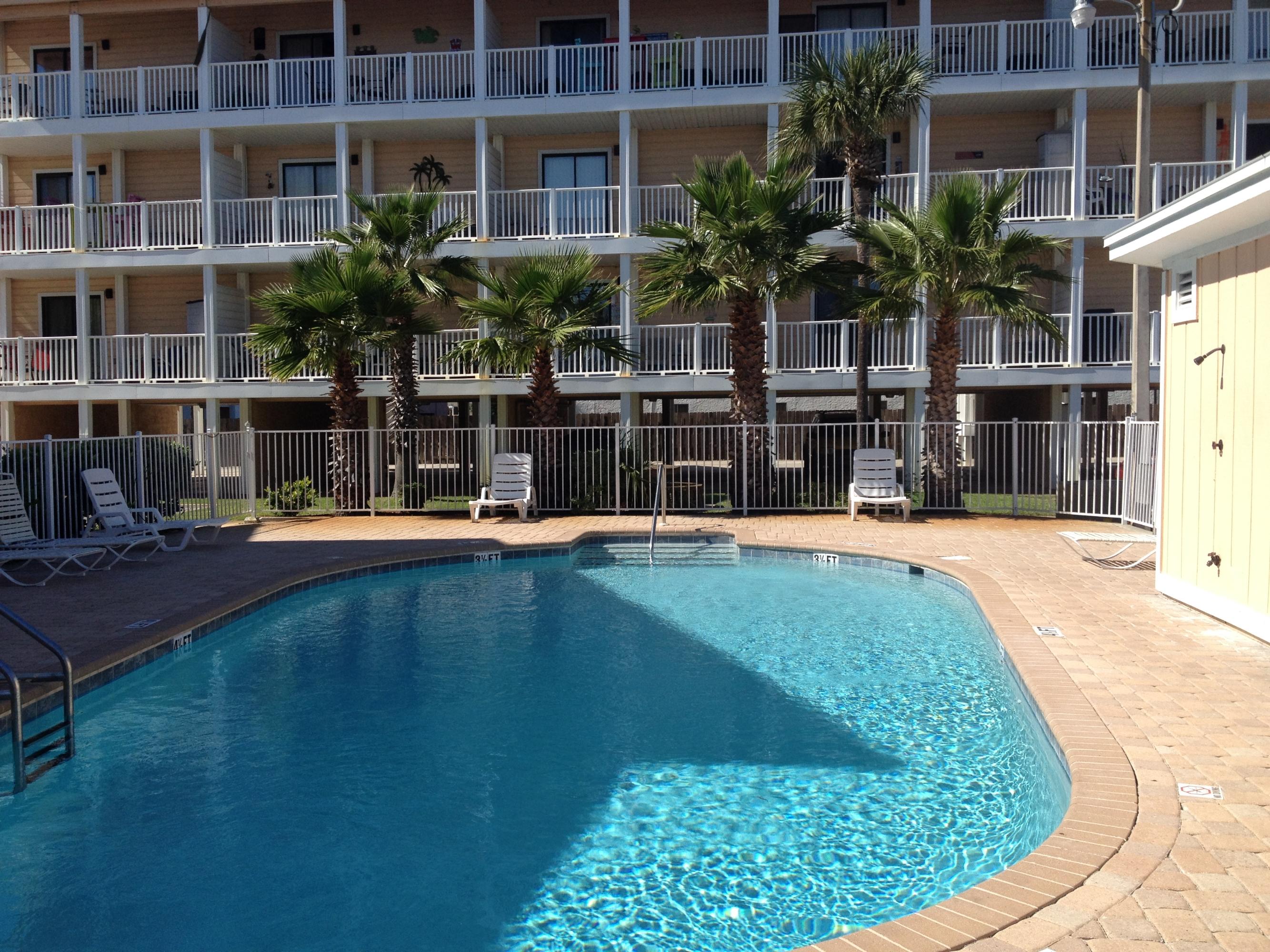 Directly across the Gulf, and overlooking the pool, this 2nd floor unit is immaculate. The owners purchased the property two years ago and set out to remodel it entirely : tile, ceiling, paint, appliances (including two flat screen tv, plus washer and dryer), AC, faucets, doors, light fixtures, ceiling fan and more. All appliances and furniture convey with the exception of a few personal items.This charming condo is ready to move in and offers all the conveniences within walking distance. The beach is directly across and Publix and Winn Dixie are 2mns away.In addition to the swimming pool, and shuffle board, the complex boasts BBQ pits, picnic tables and chairs, a manicured lawn with lots of palms, plus one covered parking space beyond the common area. Don't wait to acquire this gem!