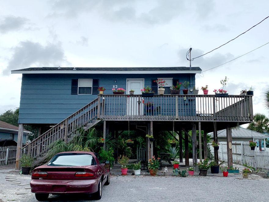 Build your dream home in Crystal Beach or live in  cozy two bedroom rental home . This cozy beach house features a large deck that wraps around half of the home and below the home there are picnic tables and a swing that make it a great area to entertain. This property includes a portable washer and a small dryer. You will love being only a block away from the beach! Property being sold as is.