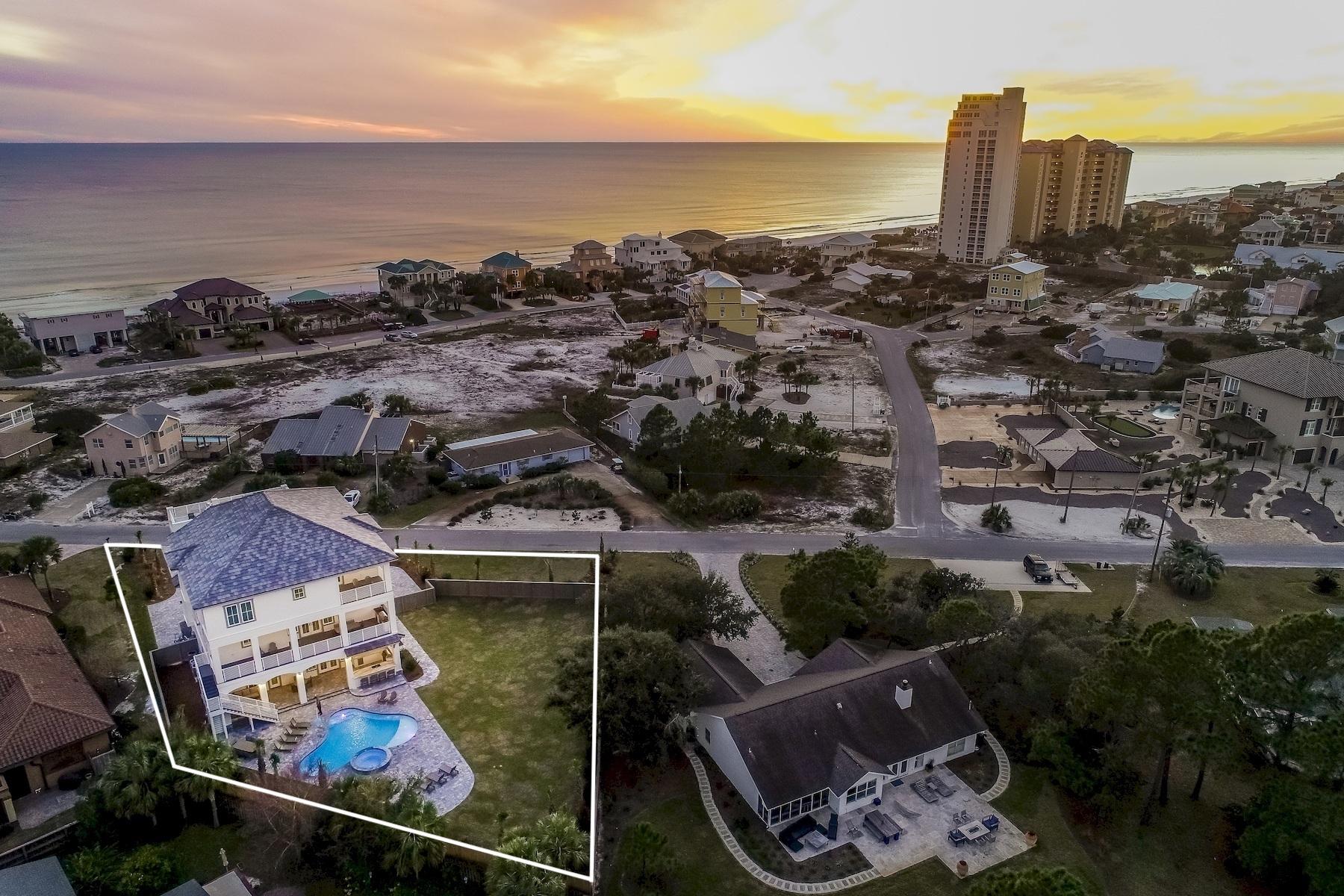 Newly completed in January 2019, this sleek coastal contemporary masterpiece is perfectly situated on over half an acre to capture 180 degree gulf views from each of the three finished levels as well as the fourth story rooftop deck.This property is comprised of over 9,400 square feet of total space with several expansive covered porches including a sun deck. Heated and cooled square footage is 5,980.