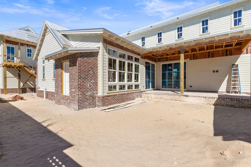 The Evangeline Plan by Key Lime Construction showcases timeless coastal architecture blended with refined modern design, offering 4 bedrooms, 4 full baths, 2 half bathrooms in the main house plus a carriage bedroom with a full bathroom, kitchenette, and flex area over the detached 2-car garage. From the moment you enter through the brick-arched foyer, the home welcomes you with soft natural light, engineered hardwood flooring, and an effortless open-concept layout designed for both comfort and sophistication. The living room features custom built-ins and a direct-vent brick fireplace, creating an inviting focal point for family and guests.The gourmet kitchen serves as the heart of the home, anchored by dual 10-foot islands, one ideal for daily prep and casual seating, and the other enhanced with both an under-counter beverage refrigerator and a wine cooler. Premium Wolf/Sub-Zero appliances, including a cabinet-panel refrigerator, blend professional performance with polished design. Two separate walk-in pantries (one being a fully equipped butler's pantry styled as a modern-day scullery) offer remarkable functionality, complete with a double- oven, refrigerator, dishwasher, sink, and ample storage. Arched openings lead seamlessly to the dining area and adjoining sitting room, creating an airy sense of connection throughout the home's central living spaces. 

The primary suite on the main level offers a peaceful retreat featuring tray ceilings, a spa-inspired bath with dual vanities, a freestanding soaking tub, a glass-enclosed shower with dual shower heads, and a large custom walk-in closet with built-in wood shelving.

Upstairs, three additional guest suites, each with a walk-in closet, offer private bath access and thoughtfully curated finishes. Tucked away on this level, an expansive media room with a vaulted ceiling provides an inviting retreat for entertainment or relaxation.

A true showstopper, the outdoor living area unfolds as a private, resort-style sanctuaryfeaturing a retractable-screen porch with heirloom brick flooring and a gas fireplace overlooking the saltwater pool with sun shelf and integrated spa. Beyond, a built-in fire pit and brick pavilion with a fully equipped summer kitchencomplete with NatureKast cabinetry, natural gas grill, beverage refrigerator, sink, and covered lounge area create the perfect setting for year-round entertaining. A dedicated pool powder room adds convenience to this exceptional outdoor oasis.

Architectural details such as James Hardie siding, KDAT wood columns, corrugated metal roofing, and brick accents reinforce the home's enduring quality and craftsmanship. With 8-foot solid core doors, quartz countertops throughout, under-cabinet lighting, and custom millwork in every room, the Evangeline Plan embodies coastal luxury at its finest an exceptional offering in the heart of Powell Landing East at Watersound Origins.

Estimated completion: June 2026

Experience refined coastal living in one of Watersound Origins' most sought-after neighborhoods nestled alongside Lake Powell. The Watersound Origins community offers an unparalleled lifestyle in South Walton - exceptional amenities, notoriously friendly and welcoming atmosphere, zero short-term rentals, and close proximity to all that 30A and Inlet Beach has to offer. Enjoy the zero-entry pool, playground, sports courts, and fitness center at the Village Commons, play a round of golf or foot golf at the Origins Golf Course, or take a walk along the many miles of walking and biking trails that wind all throughout the neighborhood!

The new Watersound Town Center located at the entrance to the community offers several fantastic dining options (casual and formal), medical services, Starbucks, Publix, a Pavilion that hosts events year round, and more!