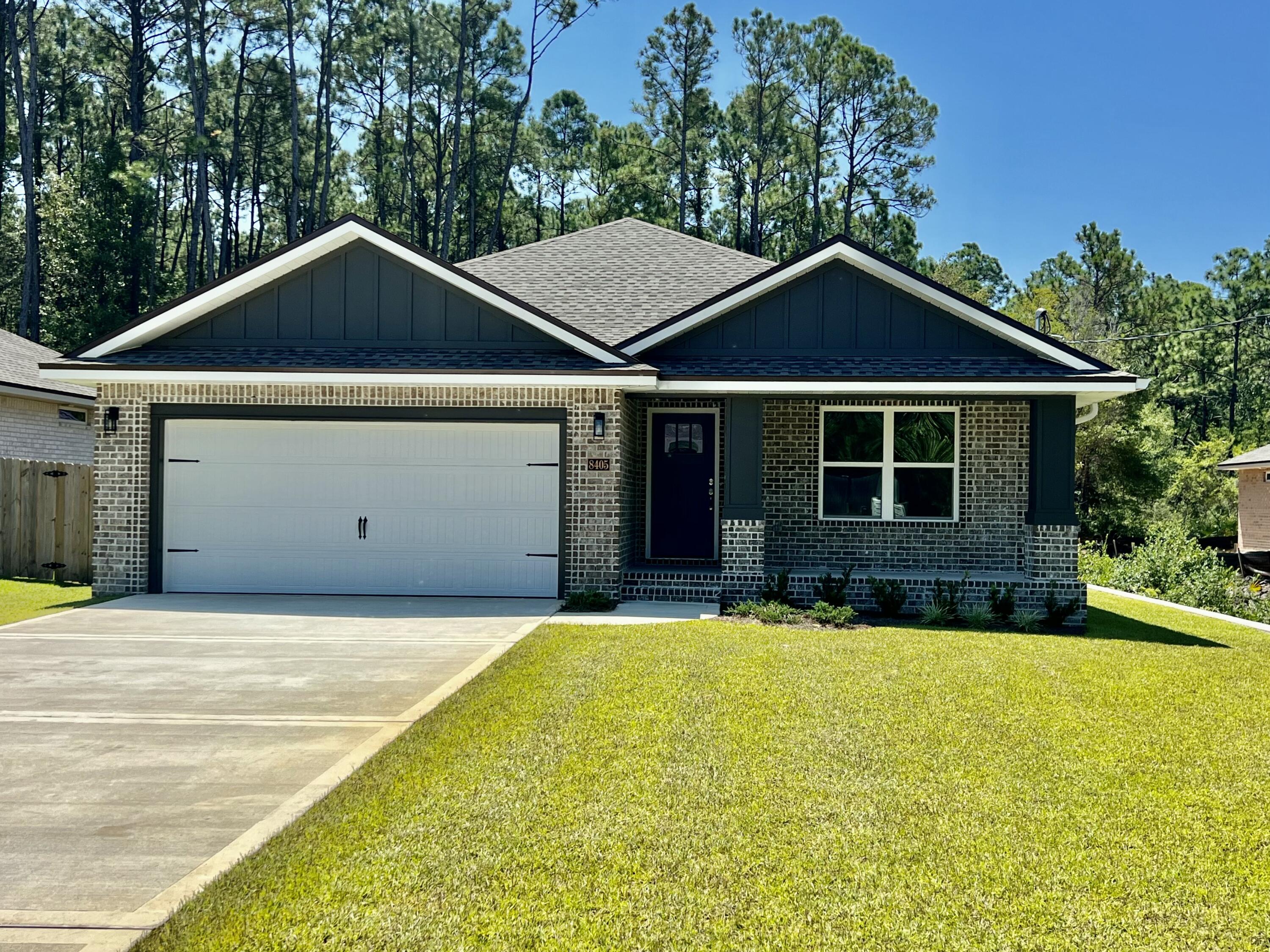 NEW CRAFTSMAN Custom Built Home ~ this luxurious 3 bed/2 bath floor plan is ready for its new owners . Fall move in offers builder incentives too. ~Great Central Location with easy access to Navarre Beach, Navarre Waterfront Park and Hwy 98 to Hurlburt Field AFB.This Stunning Robbins Builders Home offers trend setting features~Greeted by a walk in foyer sweeping through to your open floor plan ~Large kitchen enjoying custom cabinets with crown molding, beautiful quartz counter tops~under mount sink~S/S appliances, large double door pantry & closed off utility room ~sleek top center Island with pendant lights ~open flow to the family room with patio doors out to the large covered porch .Wood look LVP throughout with tiled bathrooms~ Large master with trey ceiling /ceiling fan and walk-in closet ~master bath offers an oversized TILED shower ~ double vanity with picture frame mirrors. Additional Bedrooms are a great size with double closets and ceiling fans~Home has a welcoming covered front porch and large covered back porch to sit out and enjoy those wonderful Florida evenings ~great to cook out and entertain. Grassed yard with irrigation system for easy care in the summer months. TAEXX in wall pest control system~ Hurricane protection for windows and dimensional shingle roof for lower insurance premium. Upgrades throughout include recessed lighting, bedroom fans, crown molding, deluxe lighting package,50 Gallon water heater, garage door remotes, attic drop down stairs~ to name a few.....Call today for further information.