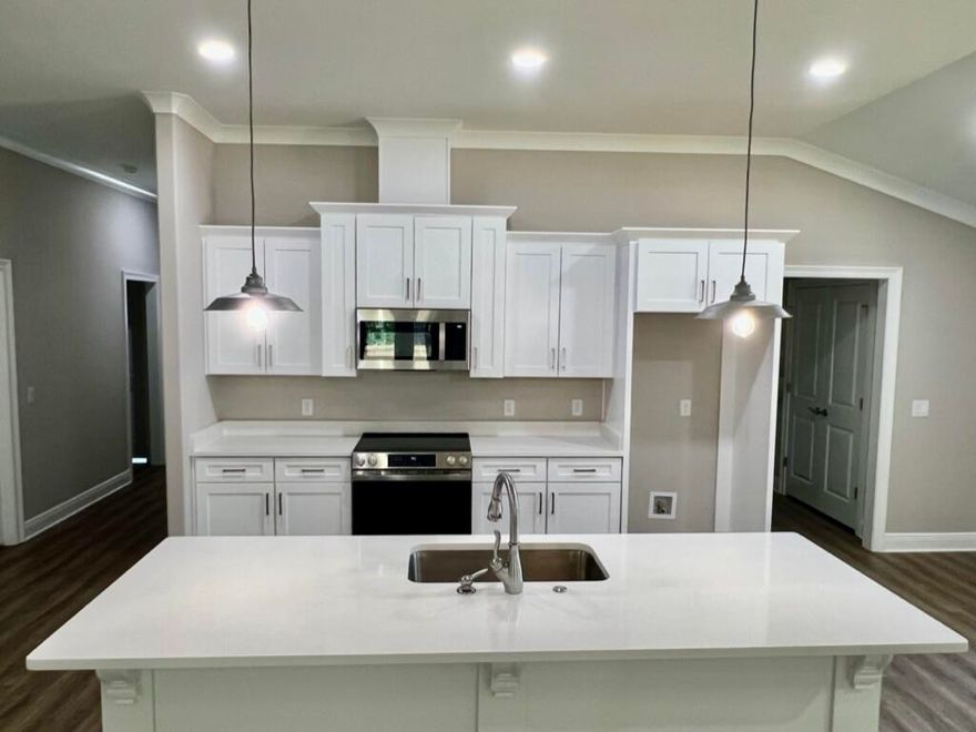 NEW CRAFTSMAN Custom Built Home ~ this luxurious 3 bed/2 bath floor plan is under construction ,in a row of new builds and will be ready in time for your Summer move in ~Great Central Location with easy access to Navarre Beach, Navarre Waterfront Park and Hwy 98 to Hurlburt Field AFB.This Stunning Robbins Builders Home offers trend setting features~Greeted by a walk in foyer sweeping through to your open floor plan ~Large kitchen enjoying custom cabinets with crown molding, beautiful granite counter tops~under mount sink~S/S appliances, large double door pantry & closed off utility room ~sleek top center Island with pendant lights ~open flow to the family room with patio doors out to the large covered porch .Wood look LVP throughout with tiled bathrooms~ Large master with trey ceiling /ceiling fan and walk-in closet ~master bath offers an oversized TILED shower ~ double vanity with picture frame mirrors. Additional Bedrooms are a great size with double closets and ceiling fans~Home has a welcoming covered front porch and large covered back porch to sit out and enjoy those wonderful Florida evenings ~great to cook out and entertain. Grassed yard with irrigation system for easy care in the summer months. TAEXX in wall pest control system~ Hurricane protection for windows and dimensional shingle roof for lower insurance premium. Upgrades throughout include recessed lighting, bedroom fans, crown molding, deluxe lighting package,50 Gallon water heater, garage door remotes, attic drop down stairs~ to name a few.....Call today for further information.