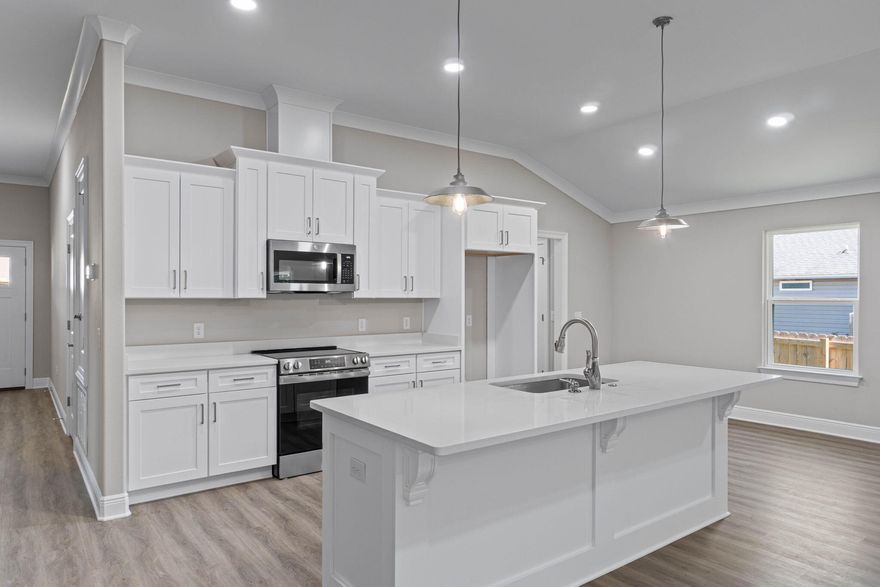 NEW CRAFTSMAN Custom Built Home ~ this luxurious 3 bed/2 bath floor plan is ready for its new owners . Fall move in offers builder incentives too. ~Great Central Location with easy access to Navarre Beach, Navarre Waterfront Park and Hwy 98 to Hurlburt Field AFB.This Stunning Robbins Builders Home offers trend setting features~Greeted by a walk in foyer sweeping through to your open floor plan ~Large kitchen enjoying custom cabinets with crown molding, beautiful quartz counter tops~under mount sink~S/S appliances, large double door pantry & closed off utility room ~sleek top center Island with pendant lights ~open flow to the family room with patio doors out to the large covered porch .Wood look LVP throughout with tiled bathrooms~ Large master with trey ceiling /ceiling fan and walk-in  closet ~master bath offers an oversized TILED shower ~ double vanity with picture frame mirrors. Additional Bedrooms are a great size with double closets and ceiling fans~Home has a welcoming covered front porch and large covered back porch to sit out and enjoy those wonderful Florida evenings ~great to cook out and entertain. Grassed yard with irrigation system for easy care in the summer months. TAEXX in wall pest control system~ Hurricane protection for windows and dimensional shingle roof for lower insurance premium. Upgrades throughout include recessed lighting, bedroom fans, crown molding, deluxe lighting package,50 Gallon water heater, garage door remotes, attic drop down stairs~ to name a few.....Call today for further information.
