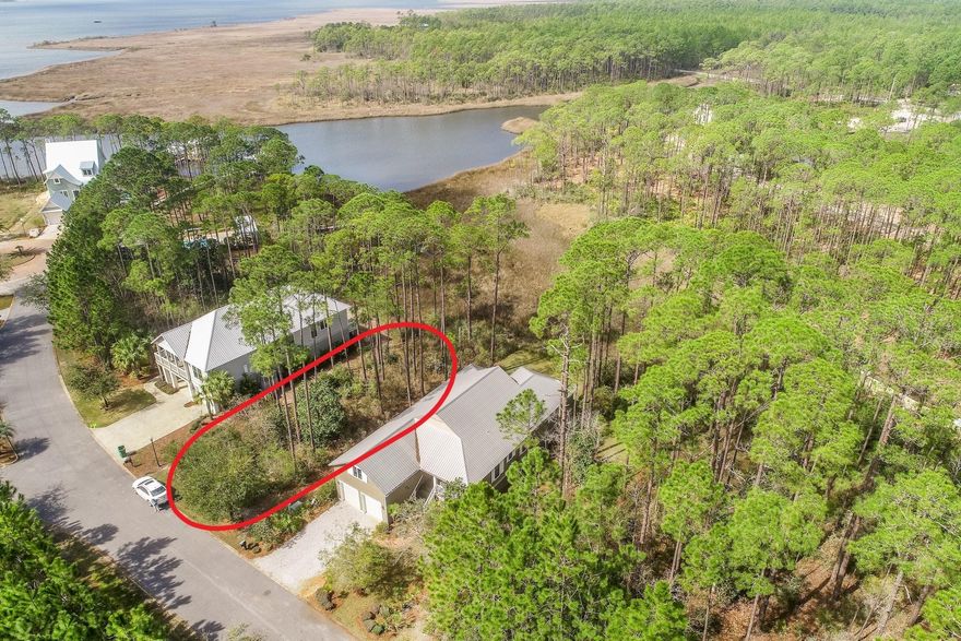 Prime vacant lot bordering Hogtown Bayou! This .26 acre lot backs up to natural protected wetlands, ensuring privacy with no further development behind. Enjoy stunning views and sunsets of the bayou and build your dream home in a tranquil setting! Cessna Landing is private, gated community in the heart of Santa Rosa Beach just a short distance from the Cessna Landing Park and boat launch. There is a beautiful community pool just a few steps from your door. The large sundeck is perfect for relaxing, and even offers a covered portion when you want to get out of the sun. Just behind the pool is a community dock, perfect for fishing or launching a paddle board or kayak for water adventures. The home next door at 159 Mallard is also for sale. The combined lots total over 1/2 an acre!