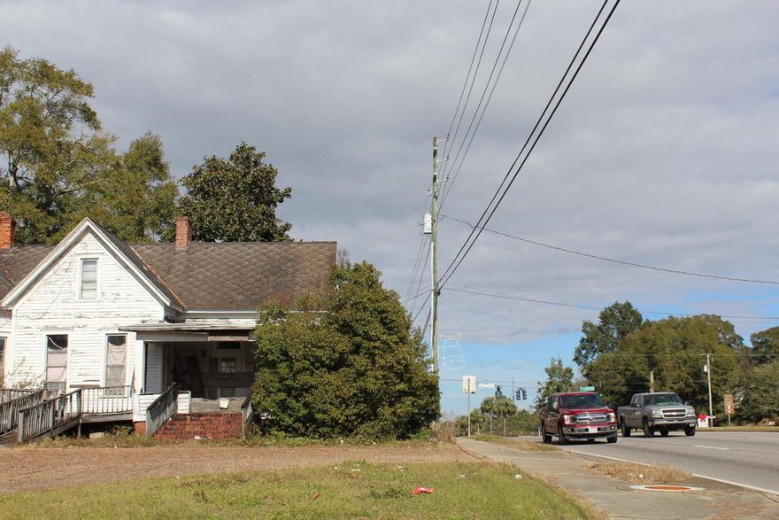 Best price on Hwy 331 between I-10 and Hwy 90. High traffic area. 150 feet of Hwy frontage on 331. corner lot. 3254 S.F. historical home. Great visibility. smart investment.