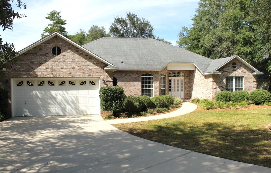 MUST SEE!!! Wonderful 4 bedroom, 2.5 bath located in the highly desired community of Bluewater Bay. Great for children, this home sits in a cul-de-sac on 1/2 acre with mature trees and backs up to the 7th Green of the Lake Course. The home is complemented with hardwood and tile floors, gas fireplace, large kitchen with custom cabinets, breakfast bar, breakfast nook, solid surface counter tops, very large master bedroom with walk in closet, large laundry room. The additional three bedrooms are larger than normal. The Florida Room offers great views of the golf course and can be used as an office. This won't last long. Measurements are approximate and need to be verified by the buyer.