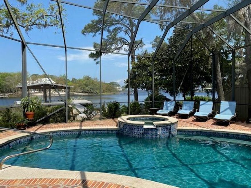 Beautiful deep water bayou home conveniently located on 110' Hewitt Bayou close to Sacred Heart Hospital and Grande Blvd. This spacious 4 bedroom, 4 bath home with master on 1st floor has 12' ceilings in living, dining and master. Shiplap walls, solid wood flooring, and solid beam columns throughout.  2600 sf dock with 2 slips and lifs. Full house generator. Oversized garage with custom shelving and epoxy flooring. New Subzero, new icemaker and new upstairs AC in the last year. Enjoy gorgeous views of the bayou, Choctawhatchee Bay, and the intercoastal beyond. Wonderful porches front and back. Large pool with screened enclosure. Beautiful live oaks and yard. (It was nominated for yard of the yr. by the Green Thumb Garden Club!) Wonderful large open porch upstairs with swinging bed.