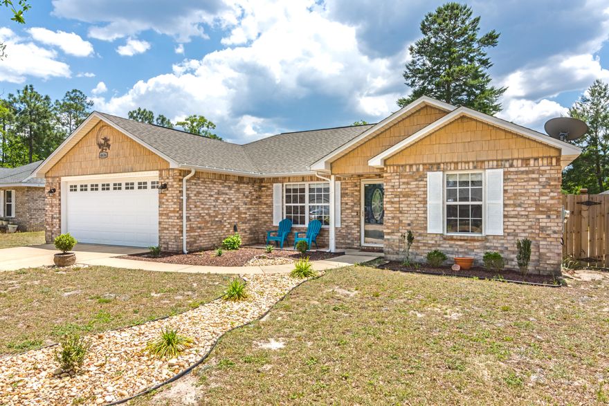 Updated East Crestview home is move-in ready! Home features an open floor plan with 3 good sized bedrooms. Living space, kitchen, hallways all have updated tile flooring and bedrooms are recently recarpeted. The kitchen features stained butcher block countertops, tile backsplash, and white cabinetry. Master bathroom is large, with a marble top double vanity and popular wood-look tile flooring. Walk in closet is MASSIVE and will satisfy the most discerning buyer. Light fixtures have been updated throughout. Lot is FLAT and fully enclosed by a privacy fence. Covered back patio provides a great spot to relax in a peaceful backyard space.