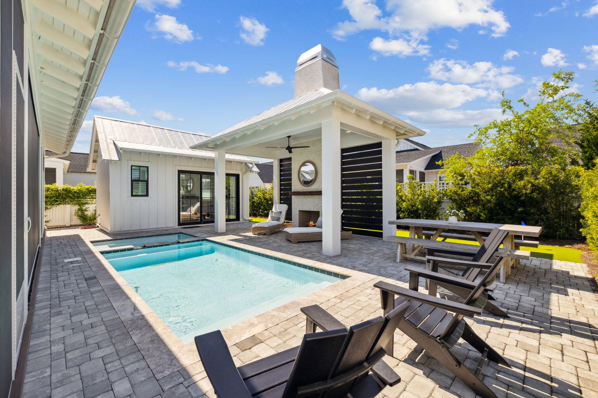 Be prepared to be amazed at 277 Catface Dr in the highly sought-after Watersound Origins neighborhood, where your first impression of a typical Romair-built Suffolk plan is just the beginning of the journey. Step inside & prepare to be impressed by this extraordinary 4-bedroom, 4.5-bath home that blends custom luxury with functional design. With a BONUS ROOM & **POOL HOUSE**, this home is truly one-of-a-kind! As you enter, the front bedroom offers versatility, functioning as both a guest room & an office with custom-built-ins & double closets, perfect for your home workspace. The chef's dream kitchen features a grand center island with paneled Thermador appliances, including a 48'' gas dual oven, 6 burners, and a griddle. Custom cabinetry with farmhouse drawers replaces traditional shelv for added convenience. The expanded dining area comfortably accommodates a table that seats 6+a thoughtful upgrade from the original design.
The spacious living room centers around a cozy fireplace, flanked by custom-built cabinets and shelves for displaying cherished family photos and treasures. The laundry room doubles as a mudroom and features a stackable washer/dryer, farmhouse sink, hidden cabinet with an ironing board, and even a 96-bottle wine fridge for the wine enthusiast.
The primary suite is an elegant retreat on the first floor, featuring French doors that lead to the screened porch. It also boasts an en suite with dual sinks, a walk-in shower, and a large closet. Upstairs, you'll find two additional bedrooms, each with its own en suite bathroom, complemented by stylish barn doors. The oversized bonus room is ideal for a kids' playroom, a game room, or flexible space for your needs. This room is also home to the whole-house Sonos AV system in a dedicated closet, making it a perfect entertainment hub. Custom California Closets are featured in every bedroom for optimal organization, and one of the upstairs bedrooms even offers access to a 500 sqft attic space for easy storage.
As you step into the backyard oasis, you'll experience something truly unique. The Nanawall sliding doors open wide to seamlessly blend the indoor and outdoor living areas. Relax on the electronic screened porch or entertain guests at the summer kitchen, complete with a 42" Artisan grill, ULine icemaker, Instahot faucet, and beverage refrigerator. The saltwater pool and spa are surrounded by elegant paver decking, leading to a pavilion with a fireplace, wood mantle, and a slatted wall for added privacy. This space is designed for ultimate relaxation and entertaining with plenty of seating, lounge chairs, and dining options.
The standout feature of this backyard is the one-of-a-kind pool house, which includes a full bath and is currently set up as a bedroom but could easily serve as a family entertainment area, complete with room for a pool table or ping pong. With its own split HVAC system, guests can enjoy customized comfort. The backyard also features a turf putting green, perfect for golf enthusiasts. Paver walkways along both sides of the house lead to the pool equipment and the front of the house.
Additional highlights include 3-zone AC on the second floor and 2-zone AC on the first floor, ensuring efficient climate control throughout the home. Plantation shutters on all windows add an elegant designer touch. The garage features a fusion wall system and California Closet cabinetry for the ultimate garage organization.
Don't miss the opportunity to make this exceptional home yoursit's a true masterpiece that checks every box for luxury living and outdoor entertainment!


