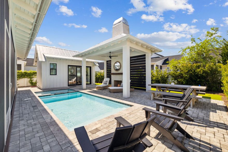 Be prepared to be amazed at 277 Catface Dr in the highly sought-after Watersound Origins neighborhood, where your first impression of a typical Romair-built Suffolk plan is just the beginning of the journey. Step inside & prepare to be impressed by this extraordinary 4-bedroom, 4.5-bath home that blends custom luxury with functional design. With a BONUS ROOM & **POOL HOUSE**, this home is truly one-of-a-kind! As you enter, the front bedroom offers versatility, functioning as both a guest room & an office with custom-built-ins & double closets, perfect for your home workspace. The chef's dream kitchen features a grand center island with paneled Thermador appliances, including a 48'' gas dual oven, 6 burners, and a griddle. Custom cabinetry with farmhouse drawers replaces traditional shelv for added convenience. The expanded dining area comfortably accommodates a table that seats 6+a thoughtful upgrade from the original design.
The spacious living room centers around a cozy fireplace, flanked by custom-built cabinets and shelves for displaying cherished family photos and treasures. The laundry room doubles as a mudroom and features a stackable washer/dryer, farmhouse sink, hidden cabinet with an ironing board, and even a 96-bottle wine fridge for the wine enthusiast.
The primary suite is an elegant retreat on the first floor, featuring French doors that lead to the screened porch. It also boasts an en suite with dual sinks, a walk-in shower, and a large closet. Upstairs, you'll find two additional bedrooms, each with its own en suite bathroom, complemented by stylish barn doors. The oversized bonus room is ideal for a kids' playroom, a game room, or flexible space for your needs. This room is also home to the whole-house Sonos AV system in a dedicated closet, making it a perfect entertainment hub. Custom California Closets are featured in every bedroom for optimal organization, and one of the upstairs bedrooms even offers access to a 500 sqft attic space for easy storage.
As you step into the backyard oasis, you'll experience something truly unique. The Nanawall sliding doors open wide to seamlessly blend the indoor and outdoor living areas. Relax on the electronic screened porch or entertain guests at the summer kitchen, complete with a 42" Artisan grill, ULine icemaker, Instahot faucet, and beverage refrigerator. The saltwater pool and spa are surrounded by elegant paver decking, leading to a pavilion with a fireplace, wood mantle, and a slatted wall for added privacy. This space is designed for ultimate relaxation and entertaining with plenty of seating, lounge chairs, and dining options.
The standout feature of this backyard is the one-of-a-kind pool house, which includes a full bath and is currently set up as a bedroom but could easily serve as a family entertainment area, complete with room for a pool table or ping pong. With its own split HVAC system, guests can enjoy customized comfort. The backyard also features a turf putting green, perfect for golf enthusiasts. Paver walkways along both sides of the house lead to the pool equipment and the front of the house.
Additional highlights include 3-zone AC on the second floor and 2-zone AC on the first floor, ensuring efficient climate control throughout the home. Plantation shutters on all windows add an elegant designer touch. The garage features a fusion wall system and California Closet cabinetry for the ultimate garage organization. In addition there is a whole house Generac Generator for peace if mind.
Don't miss the opportunity to make this exceptional home yoursit's a true masterpiece that checks every box for luxury living and outdoor entertainment!


