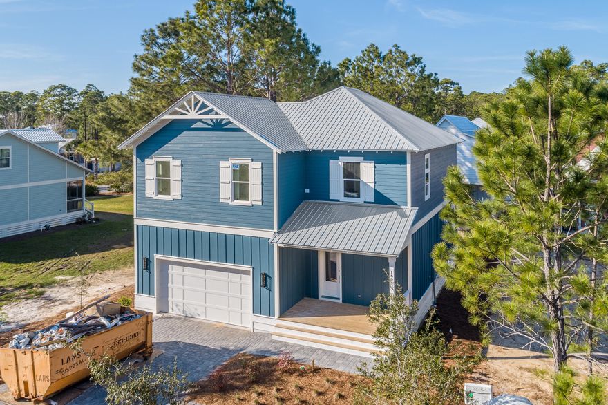 NEW CONSTRUCTION/ 3 bedroom 3.5 Bath in Hidden Grove, a gated community with a fabulous community pool. Home is solidly constructed with 2X6 framing, 8 Ft. Low E impact doors, and Low E impact windows, low maintenance Hardi board batten and lap siding, metal roof, and a wind rated garage door. Forget having to cover your windows in a storm, this is a lock-and-go home. Interiors are upgraded from the typical builder grade home. Home is well insulated, and has Energy Star Frigidaire Gallery series appliances. Oven is a drop-in range, and drop-in cooktop.  Stainless hood above.  Microwave drawer in island, 50 gallon hot water heater. Home is essentially GREEN....no carpet!....