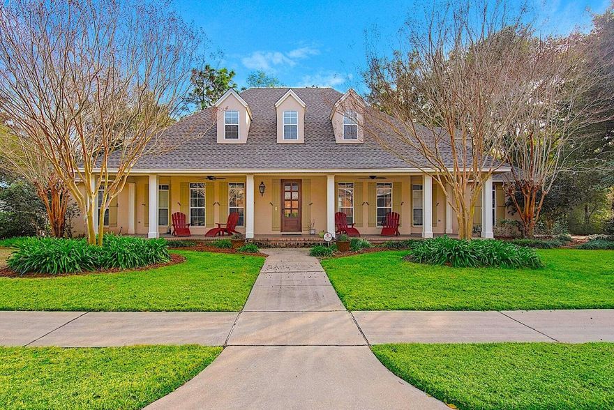 Welcome to the Southern charm of 245 Sweetwater Run. Stroll up to the scored concrete front porch just inviting you to sit down and stay a while. Adorned with front columns and an amazing entry way, this home exudes a welcoming entrance to the rest of the house. As you enter, a beautiful staircase graces the foyer before you enter a spacious den/office. Large open living room sits in the back of the home with a beautiful view of the natural landscape and incredible 21' x 9' screened in back porch. The kitchen is open with a nice island with granite countertop and sink in the island. The appliances are stainless which include refrigerator, double ovens, ice machine and gas stove. The dining room is situated in front of the house and can accommodate a sizable table and furniture. The master
