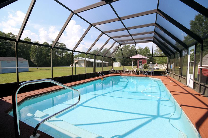 Country living at its best! The home is situated on almost an acre parcel of land. As you pull in the driveway you're welcomed by a well manicured yard and a covered front porch that's perfect for that morning cup of coffee and newspaper. The home features three bedrooms, two baths, vaulted ceiling in living room that's open to the kitchen. The kitchen has been freshly painted and has recently had many updates. This home is light and bright waiting for its new owner. Expand your entertaining to your colossal back porch that's large enough to welcome any barbecue while overlooking your large screened in-ground pool(16X32).