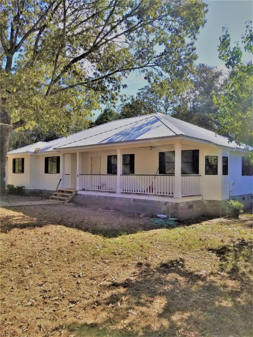 BACK ON THE MARKET AT NO FAULT OF THE SELLER!!NOW AVAILABLE AND COMPLETELY REDESIGNED!! Welcome to your coastal-inspired southern retreat in historic Defuniak Springs. This 3 BR/2 Bath home exudes southern charm and sits on 3 LOTS Totaling 1.5 acres +-. Enjoy worry-free living, with your brand new metal roof, new HVAC, new wood laminate flooring, new tile flooring, new paint, new garage doors, and brand new custom kitchen with quality butcher block countertops and SS Samsung appliance suite. The bathrooms also received attention; they were gutted from the studs out. The Master Bathroom is a showstopper, subway tile backsplash and designer lighting. This home lives large with more than 1700 sf, an open airy concept, and covered porches (front and back). cont