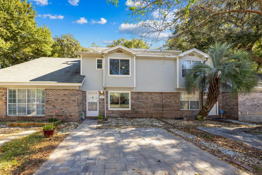Welcome to 940 Central Ave Unit 18, a beautifully maintained 2-bedroom, 2.5-bath townhome in the heart of Fort Walton Beach. Major updates include a roof replaced in 2019, impact windows (2022), paver driveway (2024), cordless bedroom blinds (2024), and seamless gutters added to the back of the home (2025). The backyard features a 6-ft pressure-treated dog-ear privacy fence with a 5-ft walk gate, stained wooden pergola, and built-in firepit perfect for relaxing or entertaining. Inside, enjoy a spacious open living area filled with natural light from a large picture window, along with a convenient half bath downstairs. The kitchen boasts stainless steel appliances, a breakfast bar, and a designated dining area with a glass slider overlooking the backyard. Upstairs, both oversized bedrooms offer ensuite bathrooms and walk-in closets, plus there's an additional large storage closet for extra space. Located in the middle of town, this townhome offers easy access to shopping, dining, schools, and local bases combining modern updates, thoughtful details, and prime location into one incredible opportunity!