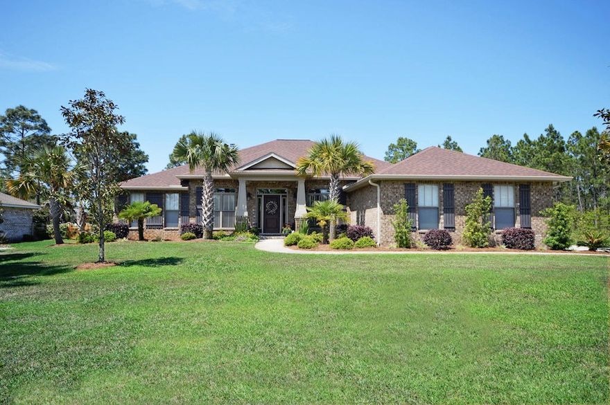 Exceptional 3065 sq. ft. custom-built Gooden Home. All brick 4 bedroom 3 full bath, 3-car side-load garage on a quiet street surrounded by beautiful green space.INTERIOR FEATURES: Open/split floor plan, fireplace with raised hearth, amazing kitchen with large breakfast bar. Granite counter-tops, tumbled tile backsplash, stainless steel appliances (double ovens, microwave, dishwasher), garbage disposal, and a large walk-in pantry. 10' raised-ceiling elevations, crown molding, tear drop and can lighting. Designer ceiling fans, upgraded hardware (oil rubbed bronze)throughout. Lever-door handles, and 2'' blinds. Floor plan features: a formal dining room, dedicated office, and a Florida room off the great room, and separated by French doors with transoms. Stressed real Hickory Flooring in th