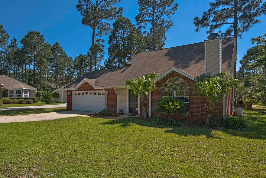 A sweet home on a corner lot with 2-car garage awaits new owners in Mack Bayou Estates. The arched living room window flanked by palm trees outside attracts abundant natural daylight. The corner living room fireplace with tile hearth has an anchored mount for a flat screen television. This area flows into a crisp white eat-in kitchen with window overlooking the back yard. This ubiquitous heart of the home also offers a bar for afternoon snacks, homework station or even breakfast. Stepping outside onto a pebble concrete patio, one can enjoy the spacious lawn, capable of hosting all sorts of outdoor games and activities. Earthy tones drawn from nature flow into the bedrooms with one bedroom, bathroom and triple closets on the main floor. Stairs lead to carpeted bedrooms on the second level,