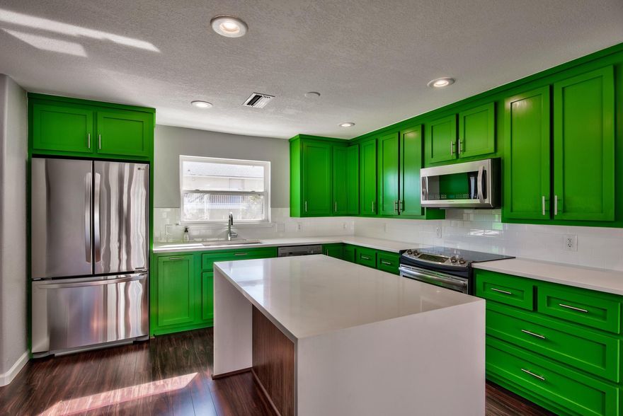 Phenomenal opportunity to own a unique fully renovated waterfront property in Destin with a BOAT SLIP! Enjoy the coastal lifestyle right outside your door with 20 feet of canal frontage, a deeded slip that can cater up to a 25 ft. boat and direct access to the Destin Harbor, East Pass & Gulf of Mexico. This 3-story townhome offers a great balcony, 1-car garage and 2 dedicated parking spaces. Brand new flooring extends across the main floor with leveled sub-flooring. The kitchen was just updated with stunning Quartz countertops, top of the line stainless steel appliances including a silent dishwasher & disposal, classic white subway tile backsplash and high gloss soft close cabinets with new contemporary pulls. The green is a refreshing pop of color against the darker flooring.