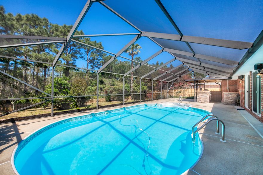 Great home with great amenities. Enclosed HEATED pool with outdoor kitchen. Fresh landscaping including pavers, landscape rocks, well manicured bushes, and grapefruit trees. Don't miss this freshly painted open floor plan home!