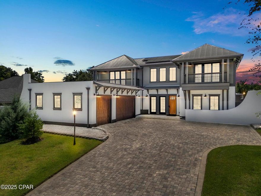Resort luxury meets everyday living in this custom 5BR, 6.5BA home in the gated, Lake Merial Community! Welcome to 158 Lake Merial Blvd a home of timeless elegance and modern sophistication. Perfectly positioned in the quiet, gated enclave of Lake Merial and just moments from Bozeman School (K-12), this custom-built estate offers 5 bedrooms, 6.5 baths, and an unparalleled blend of comfort, privacy, and style. From the moment you arrive, the architectural presence is undeniable. Manicured grounds, an oversized three-car garage with epoxy flooring and custom cabinetry, and a paver drive set the tone for the detail and craftsmanship within. Inside, the home reveals itself with wide-plank flooring, soaring 20-foot vaulted ceilings, and walls of natural light.  At its heart, a chef's kitchen designed for both function and beauty  a massive 10'x6' Carrera marble island, Viking and Fisher Paykel appliances, Butler's pantry with prep sink and ice maker, and a 200+ bottle climate-controlled wine cabinet. The expansive dining and living areas easily host family gatherings or elegant entertaining. The Owner's Suite is a sanctuary unto itself, nearly 1,000 sq ft of private luxury overlooking Lake Merial, while the spa bath features a rainfall shower with body jets, freestanding soaking tub, dual vanities, and a custom dressing room with center island and jewelry storage also having a balcony overlooking the pool. Additional 4 en-suite bedrooms provide refined comfort for family and guests alike. The outdoor living experience is resort caliber: a heated pool with infinity-edge spa, waterfall feature, and jets, surrounded by ample patio space designed for entertaining up to 40-50 guests. A fully appointed outdoor kitchen with quartz counters, Blaze refrigerator, grill, pizza oven, and fireplace. Conveniently includes a pool house with outdoor bathroom & sauna. No detail has been overlooked! Solar power with battery backup, EV charging station, CAT 7 wiring, fiber internet, hurricane-rated Anderson windows, copper gutters, and solid concrete construction are just a few of the countless upgrades. This is a property where luxury meets peace of mind. A true must-see, 158 Lake Merial Blvd is more than a home  it is a statement of refined living.