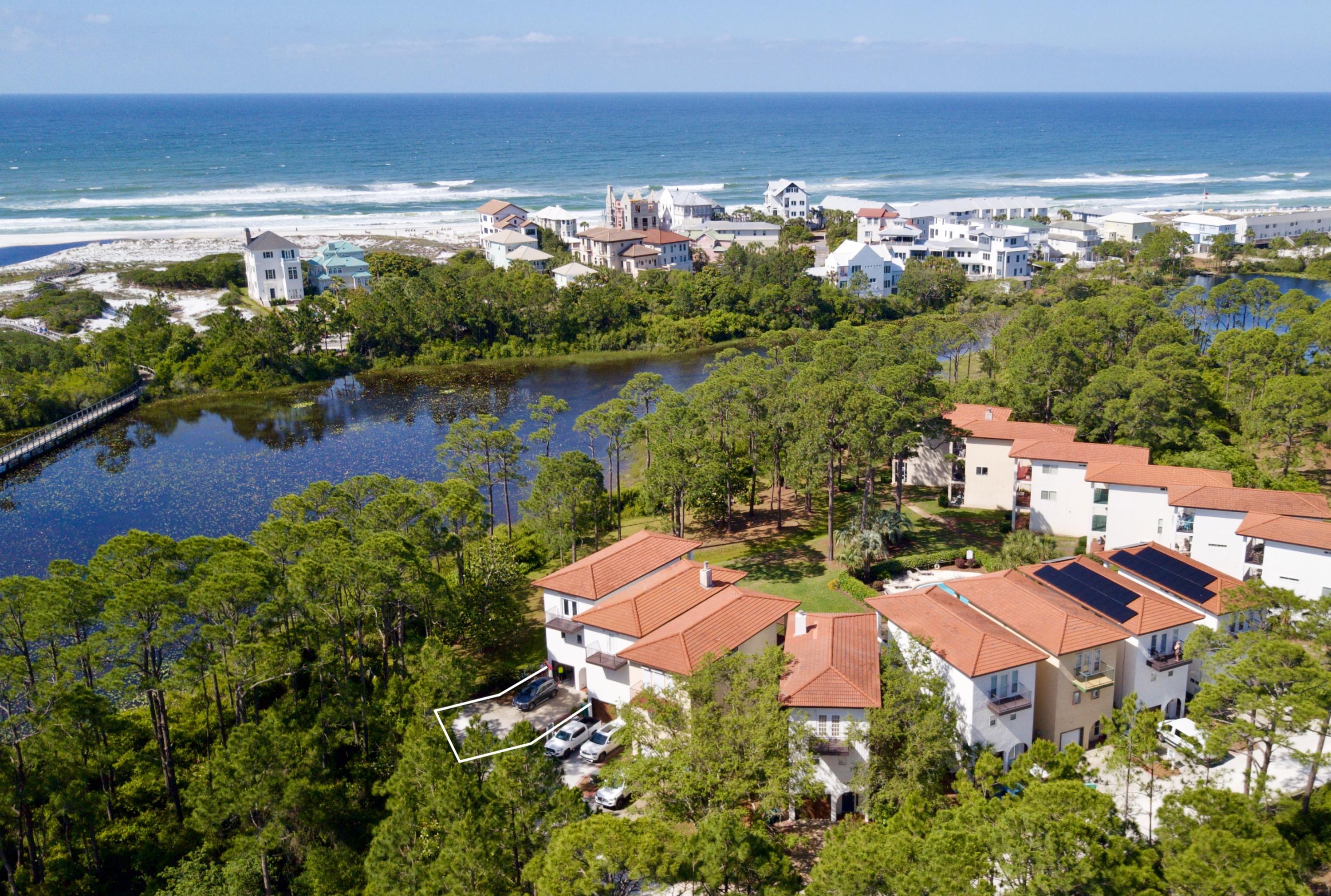114 Maralago (Sea-to-Lake in Spanish) is a private neighborhood tucked away in Old Seagrove.  This lakefront community has a total of 14 Mediterranean Villas centered around the nature and Tresca Lake with the top levels captivating on the gorgeous gulf and lake views through the tree canopies. Residence 14 offers a very intimate setting and borders the freshwater lake and nature preserve. The first floor features a lock-out accessible mother-in-law suite complete with a private bathroom and covered terrace. The main living areas offers an open floor concept and a screened in terrace- the ultimate place to take in the vibrant 30A sunsets, views and ocean breezes. The kitchen is accessorized with granite countertops, custom cabinetry, and a brand new stainless steel appliance suite.