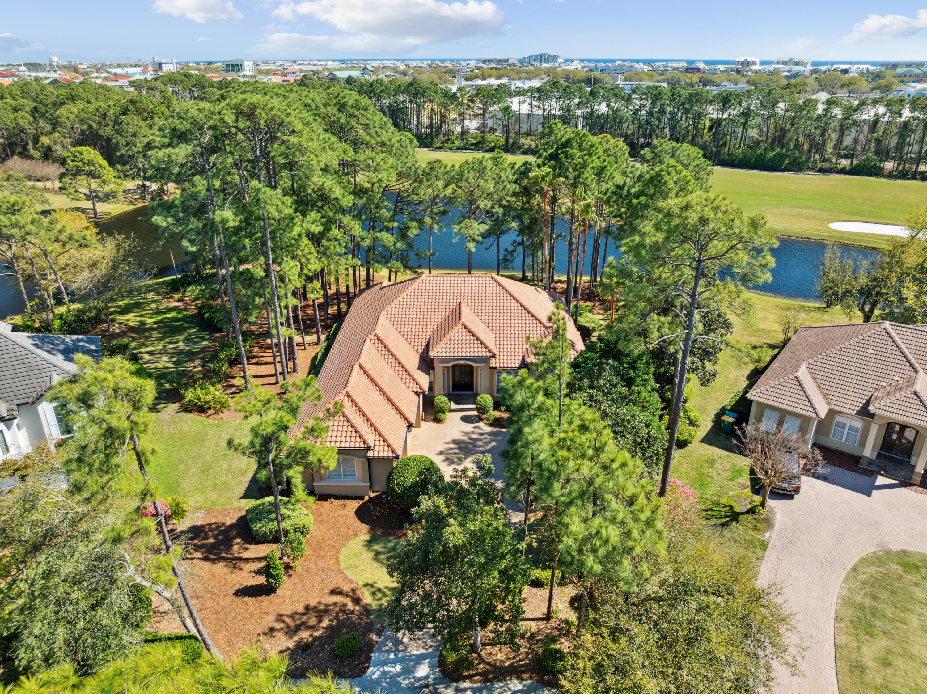 This exquisite lakefront home is a true standout, offering superior craftsmanship, high-quality materials, and expansive views. Thoughtfully designed and impeccably cared for, this custom-built residence features elegant finishes and attention to detail throughout. Nestled in a quiet loop, it offers a peaceful setting away from traffic.When stepping through the grand mahogany double entry doors, your first impression is the stunning view of the lake. Inside, the home showcases travertine and hardwood flooring, crown molding, raised tray ceilings, plantation shutters, and recessed lighting that enhances its sophisticated ambiance. California Closets are featured throughout, with the master suite boasting two spacious walk-in closets. Enjoy picturesque lake and golf course views from the living area, kitchen, breakfast nook, master suite, and media room. The home's setting provides a wonderful sense of privacy, whether you're relaxing on the screened-in porch or unwinding in the hot tub while taking in the serene surroundings.

Designed for both comfort and entertaining, this open-concept, split-bedroom floor plan provides the perfect blend of style and functionality.

Kelly Plantation offers five-star amenities, including a resort-style pool, tennis courts, pickleball courts, a playground, dog park, and a beautiful lake, making this an exceptional place to call home.
