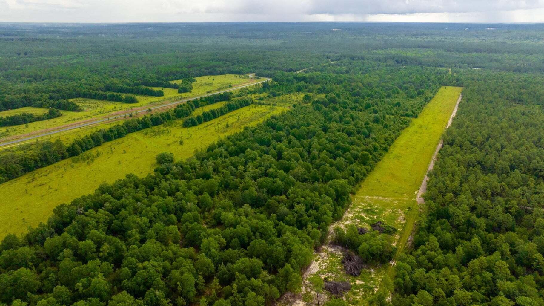 This property is a paradise for farming enthusiasts! With endless opportunities to build your dream home and enjoy the majestic beauty of the land, you won't want to miss out on this one-of-a-kind opportunity. The property has limited covenants and restrictions, And with plenty of space to hunt and ride ATVs, you'll never run out of things to do. Take a moment to relax on the front porch and enjoy the stunning views of the Oak trees, and revel in the convenience of being located in the heart of North Baker, just a short distance from the Baker School, local shopping, and beaches. Don't let this incredible opportunity pass you by!