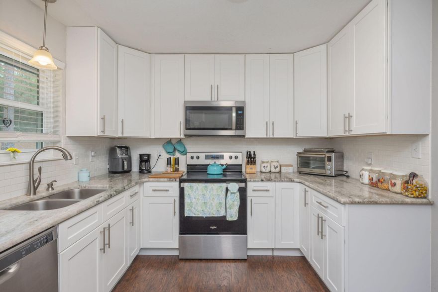 ROOM TO STRETCH OUT ON THIS 1 ACRE LOT IN NORTH CRESTVIEW!! SELLER WILL CONTRIBUTE UP TO $7,500 TOWARD BUYER'S CLOSING COSTS!! Don't miss this beautifully renovated move-in ready home! Completely updated in 2021, this 2/2 received updates including but not limited to the following. - New Roof, New HVAC, New Water Heater, New kitchen with granite and stainless steel appliances (all to convey including refrigerator), new flooring, new fans and lights, updated bathrooms, new interior doors and new paint inside and out. New windows were installed in 2022 adding both efficiency and visual appeal. Washer and dryer to convey. The home has a nice outbuilding that conveys as well. Buyer to verify all areas of importance.