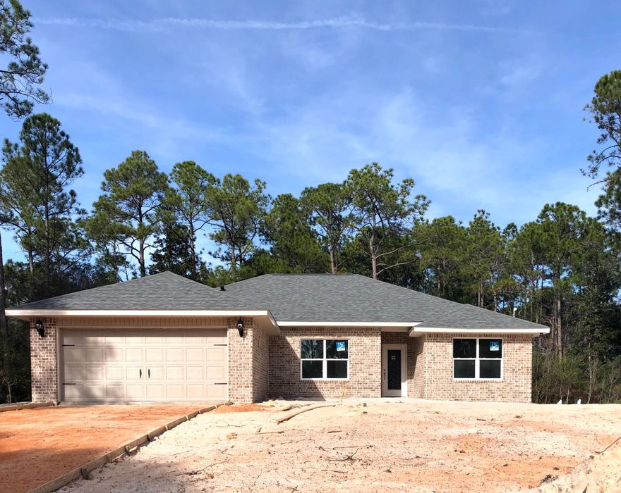 ALL BRICK HOME IN NATURAL SETTING- HOLLEY BY THE SEA.KITCHEN: Granite counters, White shaker style cabinets w/soft close drawers, Stainless appliances. Huge pantry. MASTER BATH: Granite counters, dual sink, large custom tiled shower w/seamless glass door, Dbl shelved W/I closet. MASTER: tray ceilings. PLUS: PREMIUM Vinyl wood plank floors. 12x24 tile in baths. Bedrooms carpet. Covered back porch, Ceiling fans w/light, Hurricane Fabric protection, Pull down attic, Architectural shingles, 5-1/4'' Baseboards, Crown in 10 ft. areas, Flat textured ceilings, Low-E windows, Sprinkler system. Builder Warranty. HBTS HOA Membership includes rec center - 2 pools, tennis, fishing, full gym & more!!Home completed est. mid February.(All measurements to be verified by buyer or buyers agent.)