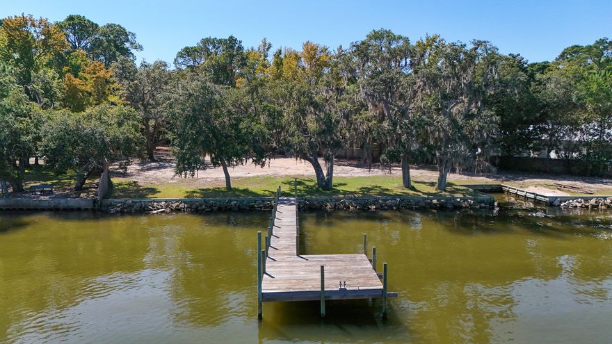 Waterfront vacant land with 198 feet on Choctawhatchee Bay. This 1.3 acres features magnificent ancient Live Oak Trees decorated with Spanish Moss and mature flowering Magnolia trees as well.  Beautiful boat dock to facilitate your easy lifestyle on this lovely and exclusive area of the Bay. The property is nicely elevated and cleared of underbrush with an excellent view of the water from all directions.  Ready for your personal view and that special new home on the Bay.