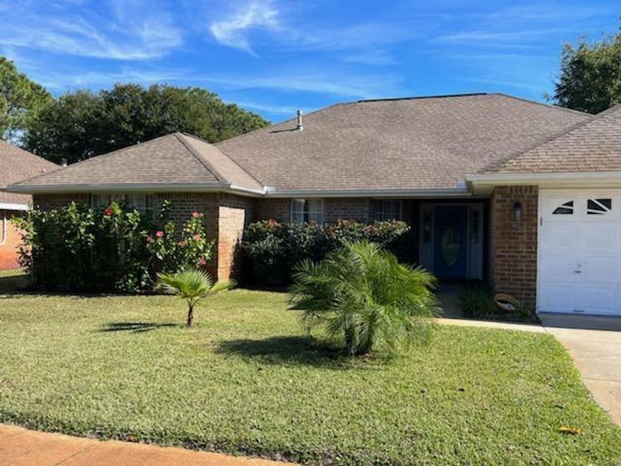 This is a 3 bedroom and 2 full bath brick home. Recently remodeled with wood like tile floors. The living room has vaulted ceilings and features a gas fireplace. There is a separate dining room and breakfast area. The laundry room includes the washer and dryer. Privacy fenced back yard with peach and grapefruit trees.