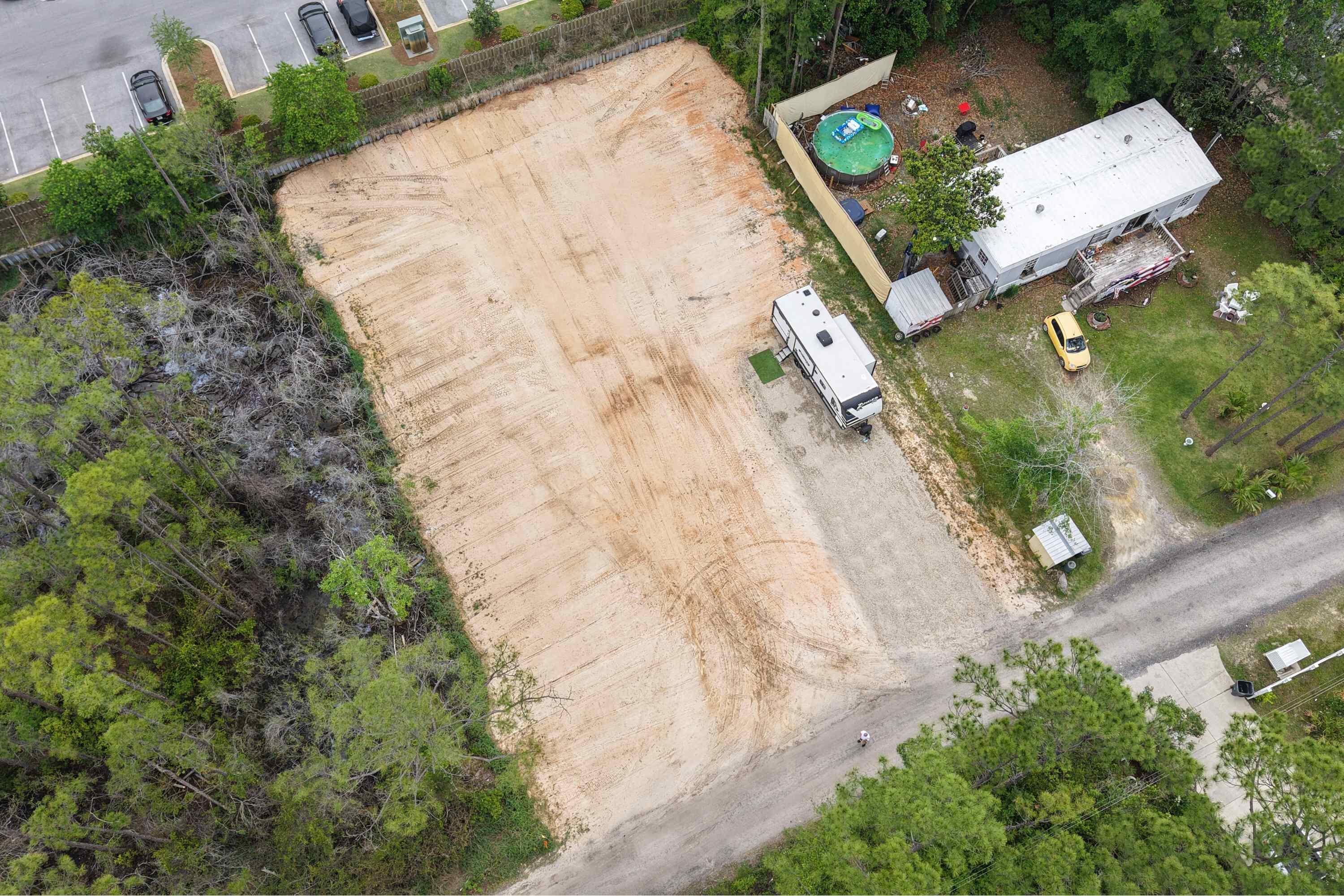 Build your dream home or short-term rental on this cleared .34 acre, high-and-dry lot in sought-after Santa Rosa Beach. Located in Flood Zone X on quiet Nuit Lane--just off Hwy 98 and minutes from beaches, dining, and shopping. This lot is ready to go with no HOA, no build-out time, and flexibility for primary or investment use. Even better; plans are in place to pave the road and add public water & sewer as part of this year's Walton County budget. A rare opportunity to own a flat, build-ready lot in a fast-growing area of the Emerald Coast. Don't miss this one!