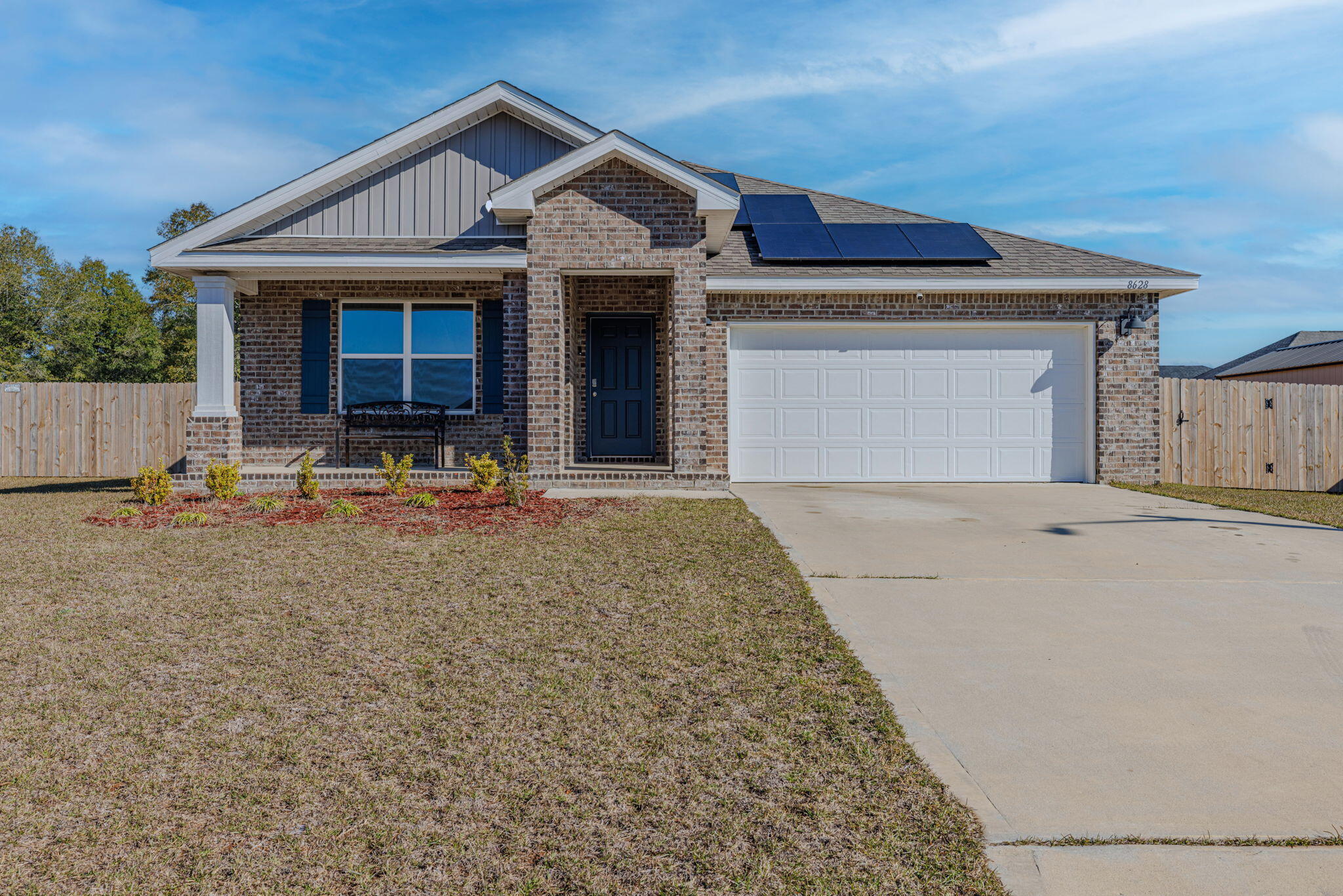 This stunning 4-bed, 2-bath home features the popular Cali floor plan with 1,830 sq. ft. of well-designed space, backs up to wooded lot for maximum privacy. FHA assumption with rate of 5.99% available to qualified buyer. The open kitchen boasts granite counters, stainless steel appliances, a large island, walk-in pantry, and smart home system. The primary suite offers a walk-in closet, dual granite vanity, large shower, and linen closet. LVP flooring throughout, carpet in bedrooms. Enjoy a covered patio and massive fenced backyard, perfect for a pool, shed, or play area. Solar panels installed to help lower utility costs! Move-in ready--schedule your showing today!