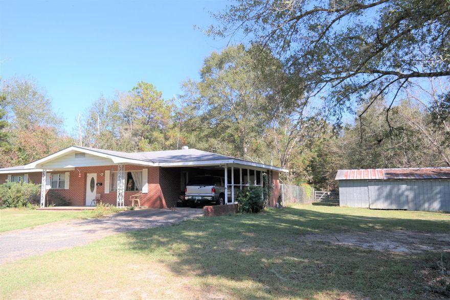 Great opportunity on this 1426 SF brick home on 29.3 acres on paved road and only minutes to public boat launch on the Choctawhatchee River. This is a beautiful piece of land with lots of mature trees (pecan, oaks, magnolia, cypress, pines). Also blueberries and muscadines. There are wet weather cypress ponds at East and West boundaries making for great hunting or just to enjoy nature. Deer, turkey and other wildlife abound. Electrical was completely rewired in 2016. Roof redone in 2006 (+/-). RV hookup with 30 amp service, septic & water hookup. Other exterior features include fenced area in back yard for pets, barn, boat shed and trails meandering throughout the property. Seller is also including 16 channel security system. You won't want to miss this one. Schedule your showing today