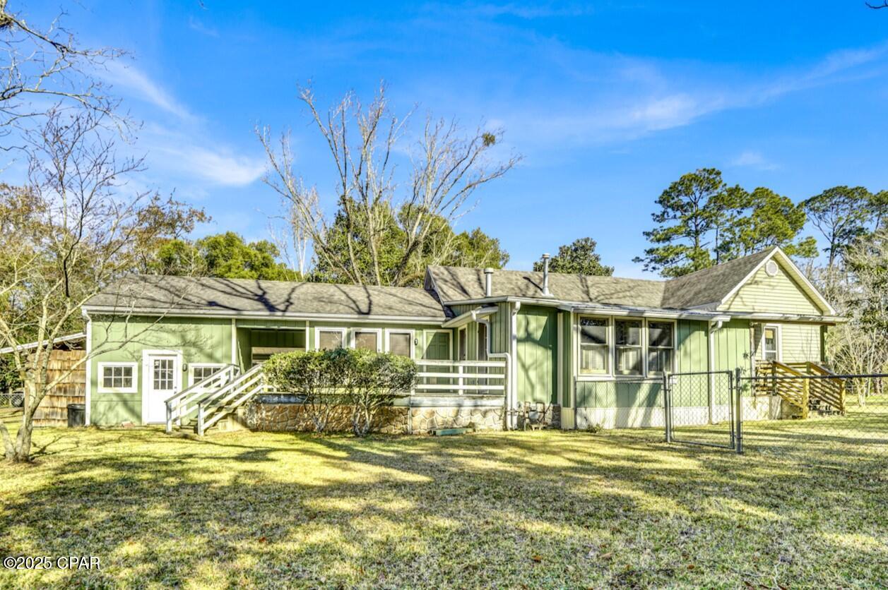 Charming 3-Bedroom Home and the Potential for a Commercial Opportunity in the Heart of Chipley, FL** Welcome to this delightful 3-bedroom, 1.5-bathroom home located in the picturesque small town of Chipley, Florida--home to the stunning Falling Waters State Park and the beloved Watermelon Festival! This unique property is just steps away from local boutiques, hair salons, mouth-watering down south BBQ, and the best coffee shop for miles, making it an ideal spot for both relaxation and entertainment. As you enter the home, you are greeted by an inviting open area featuring custom beamed ceilings & custom barn door, perfect for a cozy sitting area or a stylish dining room. The kitchen showcases charming bricked accents and is filled with natural light, creating a warm and welcoming atmosphere. The spacious living area boasts an open-concept design with custom bookshelves and modern track lighting, providing both functionality and style. One of the standout features of this property is the large fenced-in backyard, offering a private oasis for outdoor gatherings, gardening, or simply enjoying the Florida sunshine. This home presents an exceptional commercial opportunity as well. With its prime location and proximity to local attractions, it's perfect for a business venture, whether it be a cozy caf??, boutique, or rental property. With new plans for a golf course and future housing developments nearby, the income potential is remarkable. There truly is so much versatility and possibility in this property! Just off the porch, you'll find a spacious laundry room that doubles as a fantastic flex space. Whether you need a dedicated workshop, a craft area, or an extra storage solution, this room can adapt to your lifestyle. With ample natural light and easy access, it's the perfect spot to unleash your creativity or tackle your projects. This unique feature that enhances both functionality and convenience! Don't miss your chance to own a piece of Chipley paradise that seamlessly blends residential charm with commercial possibilities! Schedule your showing today and discover all the potential this property has to offer.