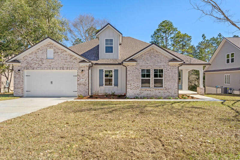 New Build + BUILDER Incentives! Located South of I-10 the Hart III offers open living space with 3 bedrooms, 3 baths, large bonus room and flex room that could be used as an office, bedroom or media room. The beautiful kitchen features a large island with granite counter tops, tiled backsplash, large walk in pantry and lots of cabinets for storage. Master suite includes a spacious tiled shower with glass door, his/her vanities, water closet along with the large walk-in closet. Floor coverings are Mohawk Revwood Plus wood laminate, carpet in bedrooms and ceramic tile in the wet areas. Upgrades include 8' doors, large covered rear porch and natural gas tankless water heater, range and grill connection. Home is complete and ready to close!!